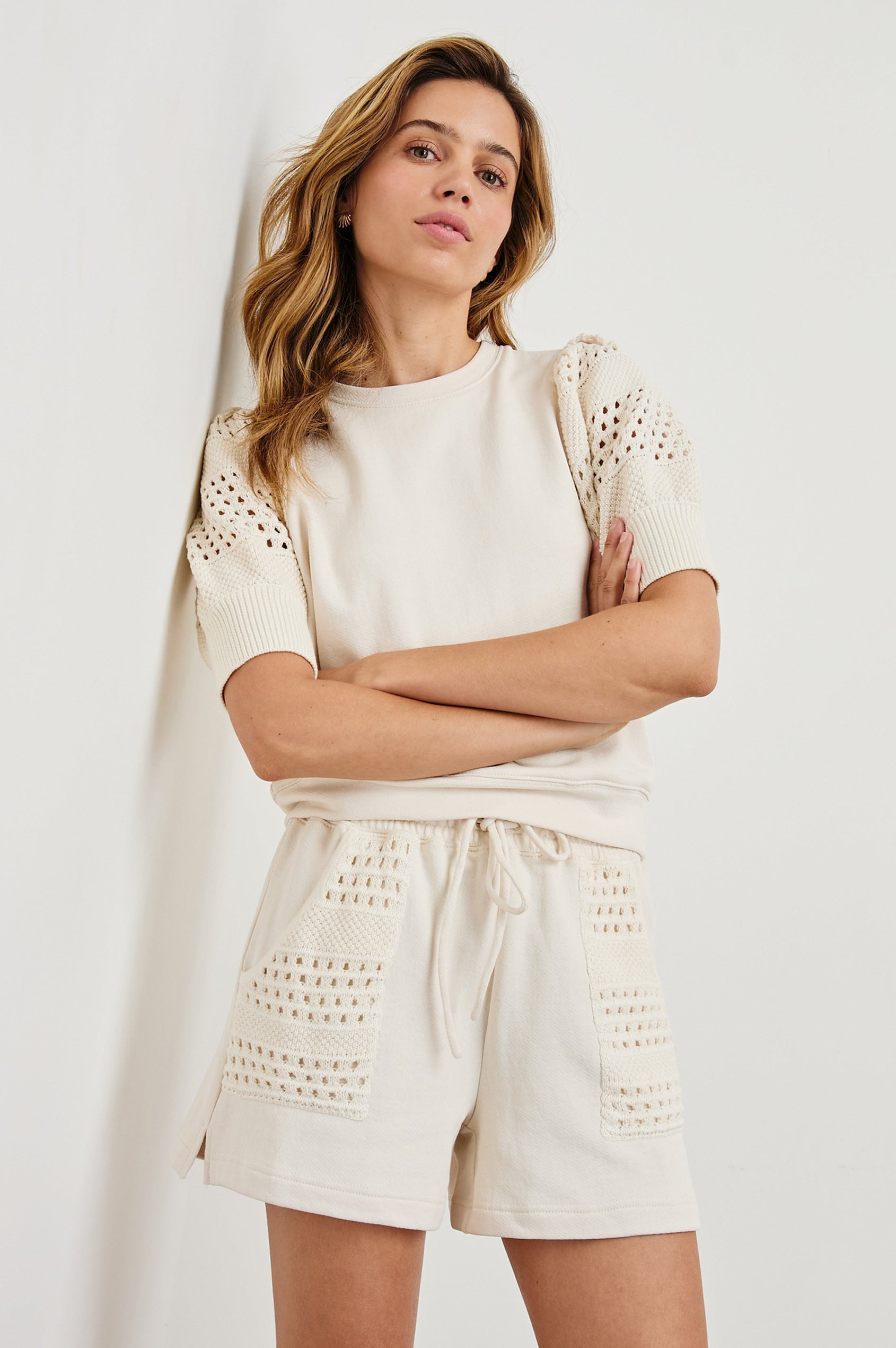 Kimberly Sweatshirt with Elbow-Length Sleeves, Ribbed Cuffs, Crew Neckline, and Crochet and Knit Sleeves in Oat Colorway - Front View Featured on Model