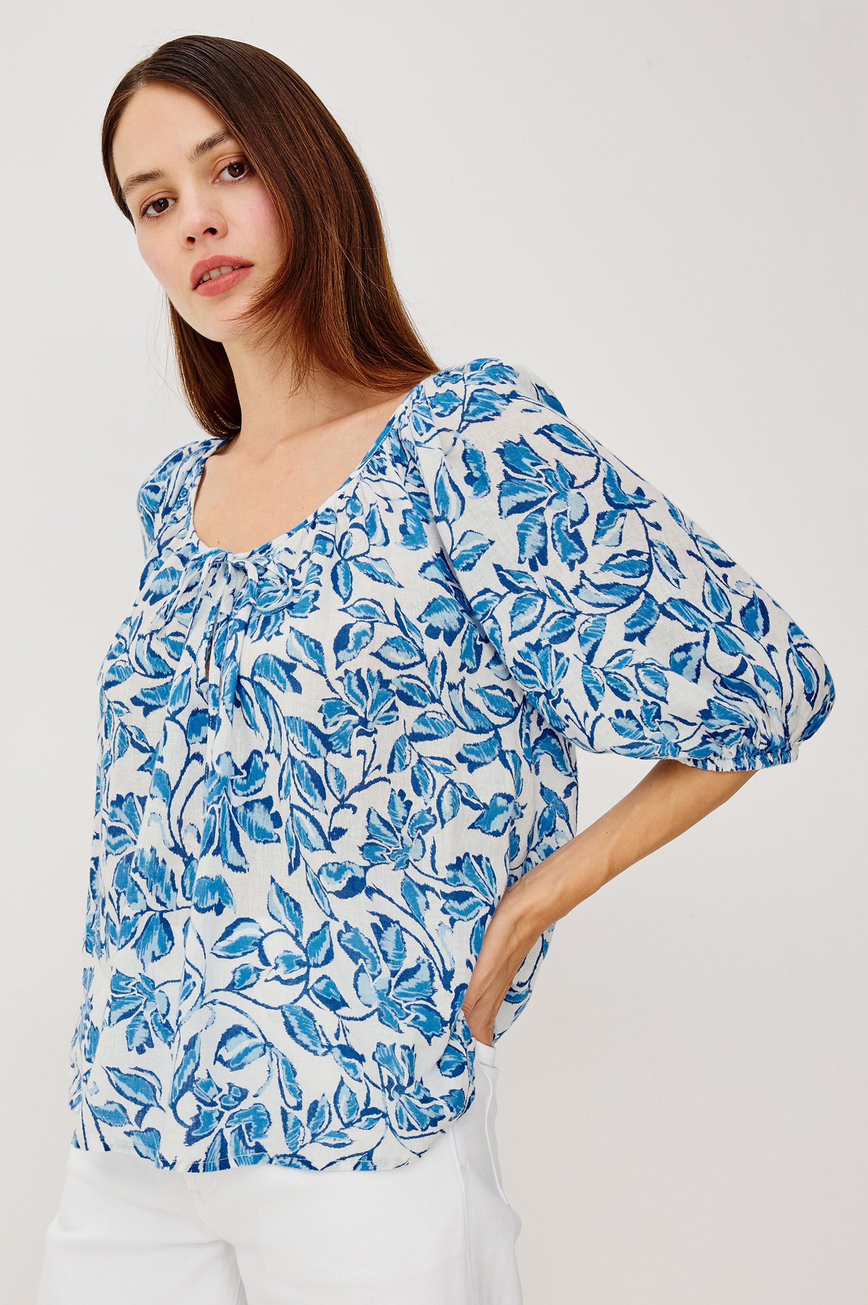 Kirstie Linen Top With Wide Scoop Neckline and Self-Ties Elbow-Length Raglan Sleeves With Elastic Cuffs and Loose Fit in Azure Jasmine Colorway - Upper Body Front View Featured on Model