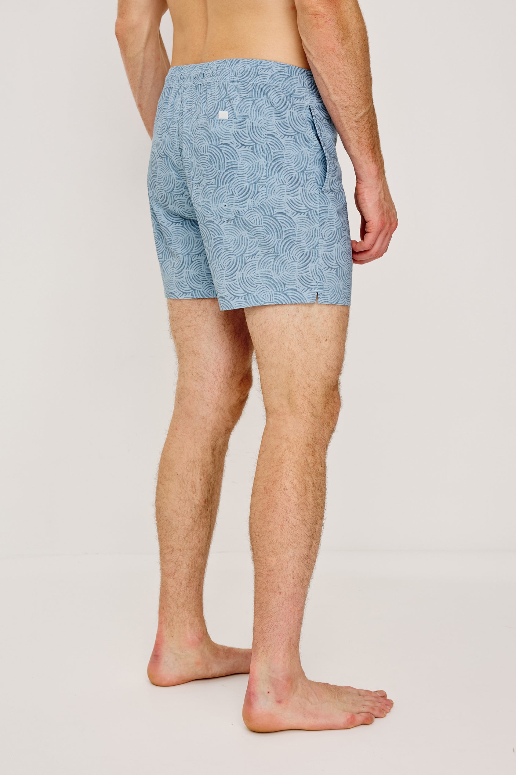 La Brea Mid-Length Swim Shorts With Adjustable Waist Drawstring Ties and Side Pockets in Conch Blue Colorway - Lower Body Back View Featured on Model