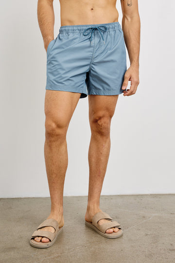 La Brea textured mid-length swim short with adjustable waist drawstring in Slate Blue - front view on model