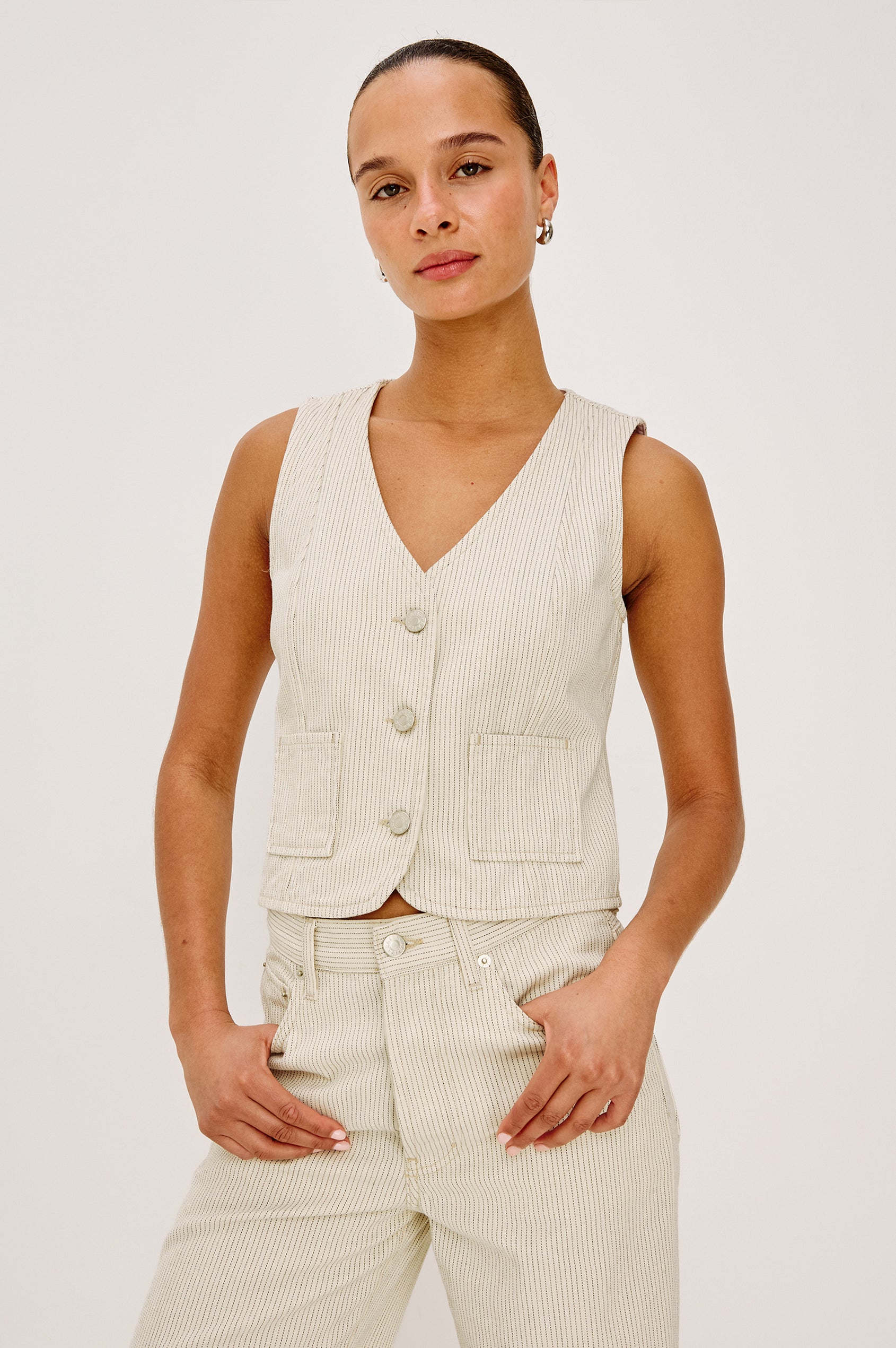 La Jolla Vest With V-Neck, Front Buttons, and Sleeveless Cut in Ecru Railroad Stripe Colorway - Upper Body Front View Featured on Model