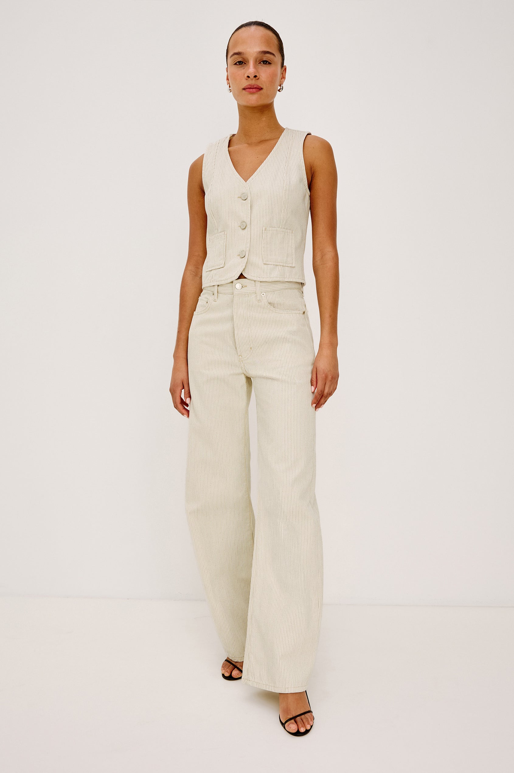 La Jolla Vest With V-Neck, Front Buttons, and Sleeveless Cut in Ecru Railroad Stripe Colorway - Upper Body Front View Featured on Model