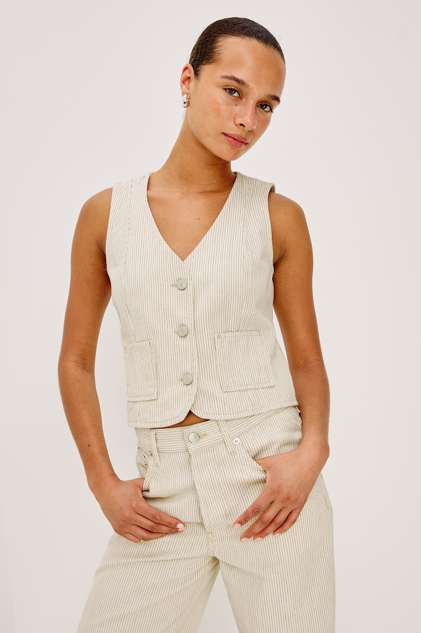 La Jolla Vest With V-Neck, Front Buttons, and Sleeveless Cut in Ecru Railroad Stripe Colorway - Upper Body Front View Featured on Model