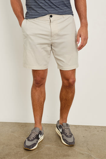 Laguna cotton lid-length short with front button closure and belt loops - front view on model