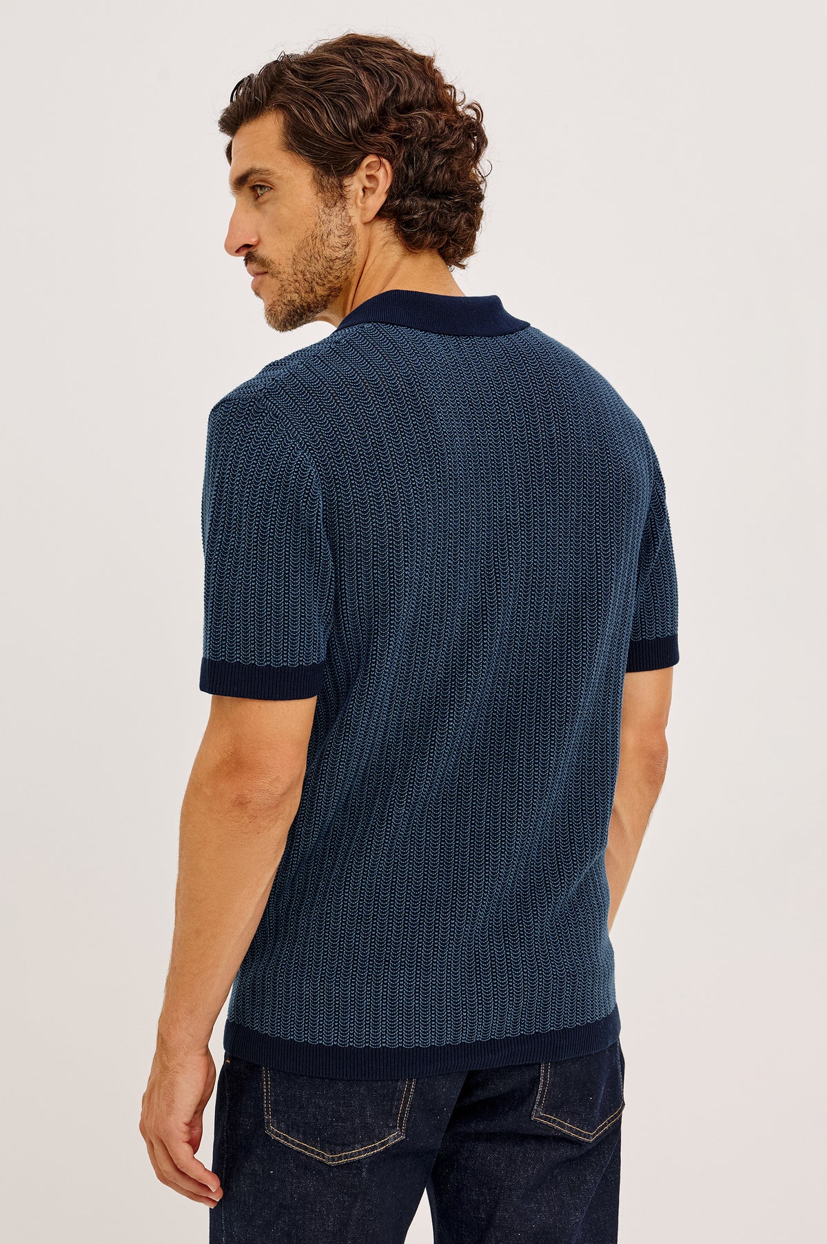 Langley Polo Shirt in Lightweight Contrast Open Birdseye Knit With Classic Fit, Open Collar, Short Sleeves, and Ribbed Trim in Navy Marine Ripple Colorway - Upper Body Back View Featured on Model