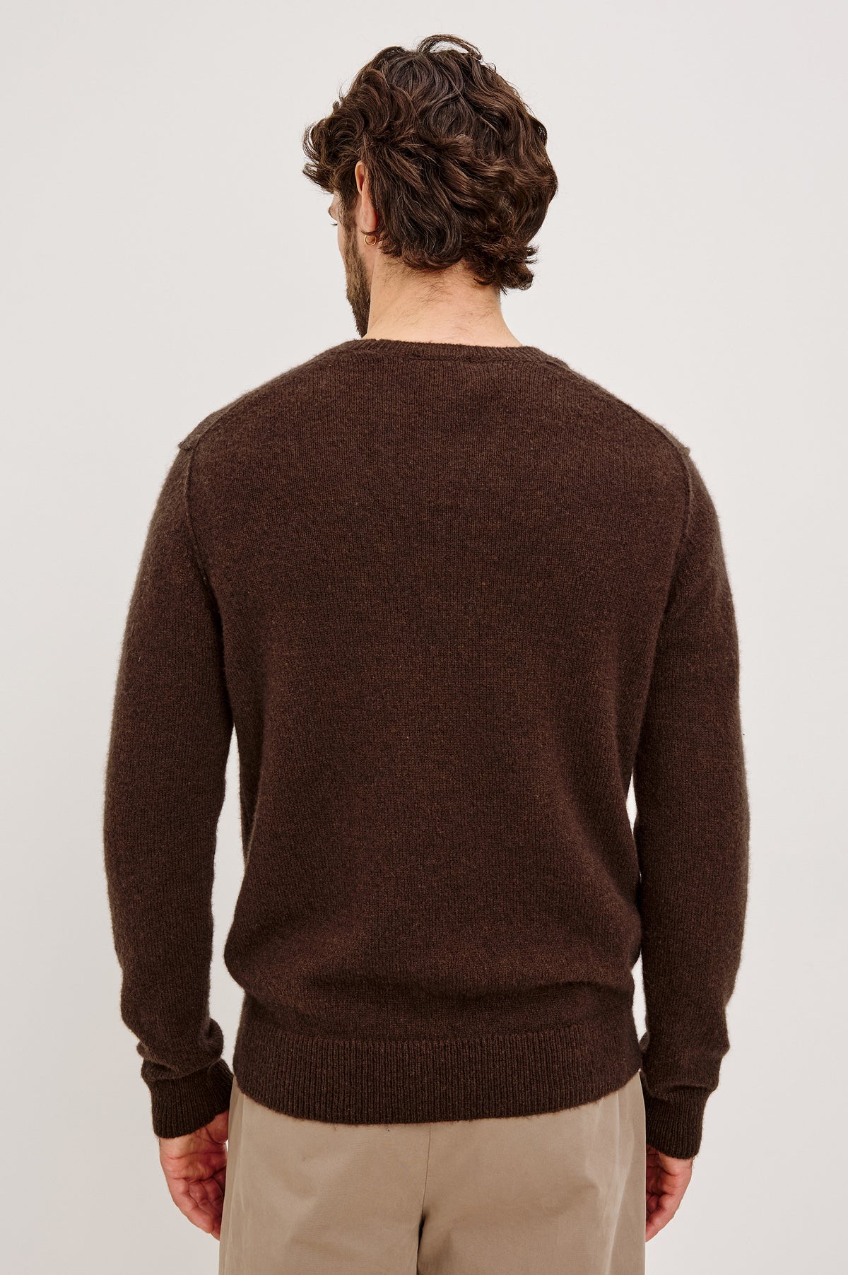 Laurent Sweater in Merino Wool Cashmere Blend With Relaxed Fit, Reversed Linking Seams at Arm Holes, and Long Sleeves in Chestnut Colorway - Upper Body Back View Featured on Model