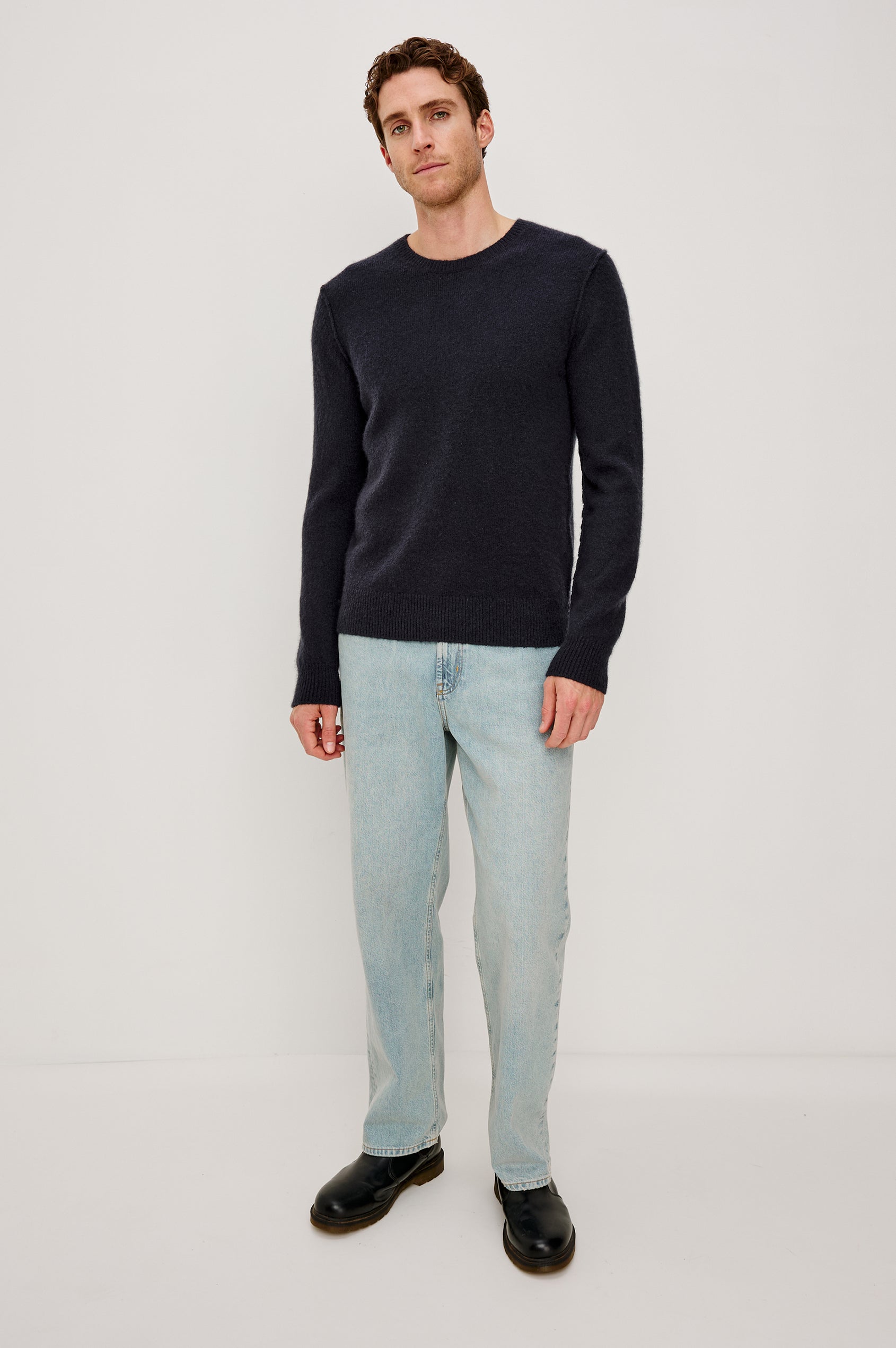 Laurent Crewneck Sweater in Wool Blend With Dropped Shoulders With Linking Stitch Detailing and Long Sleeves in Midnight Colorway - Full Body Front View Featured on Model