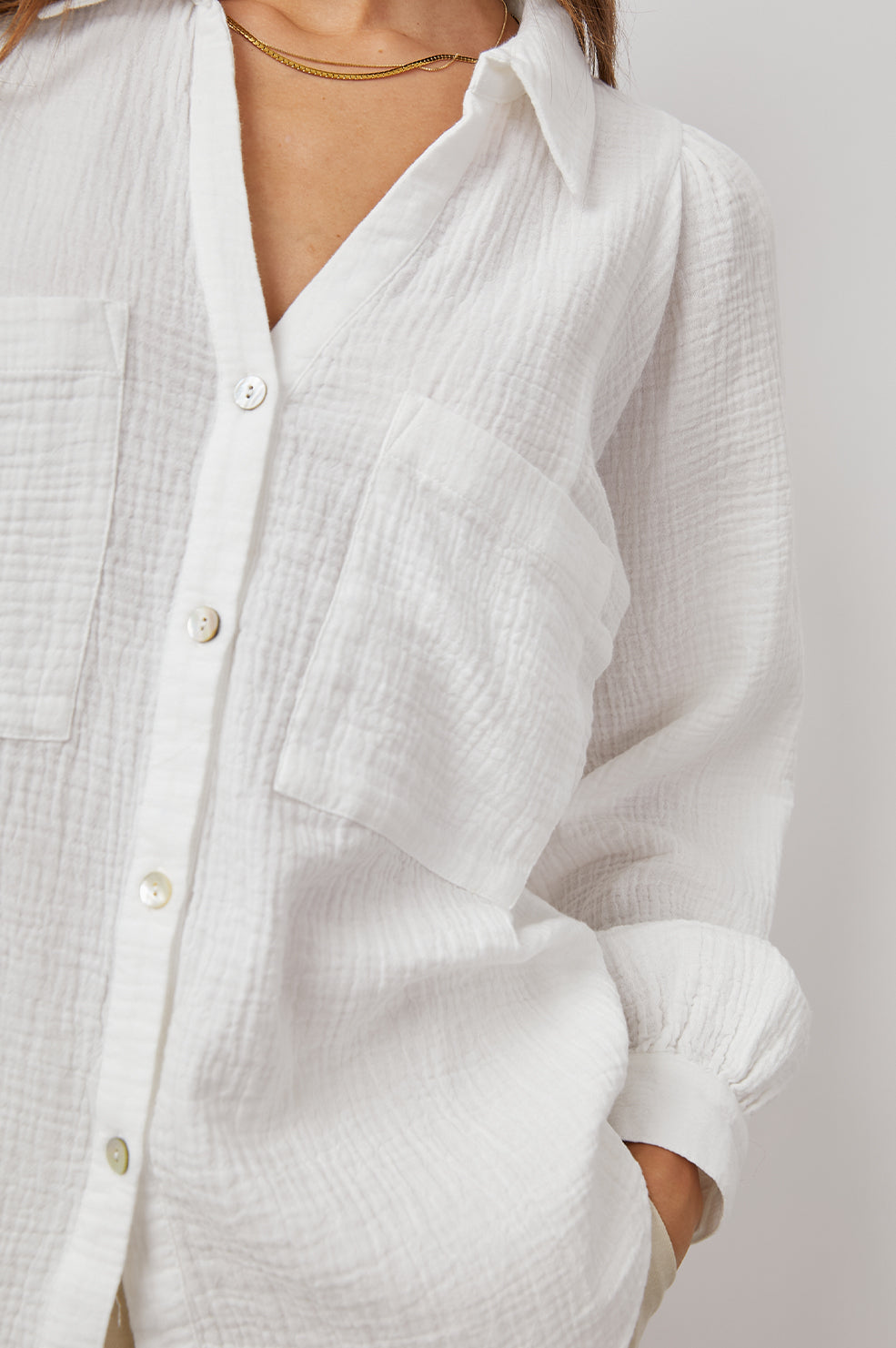 Lauren Long-Sleeve Button Up with Two Chest Patch Pockets and a V Neck in White Colorway - Front View Featured on Model