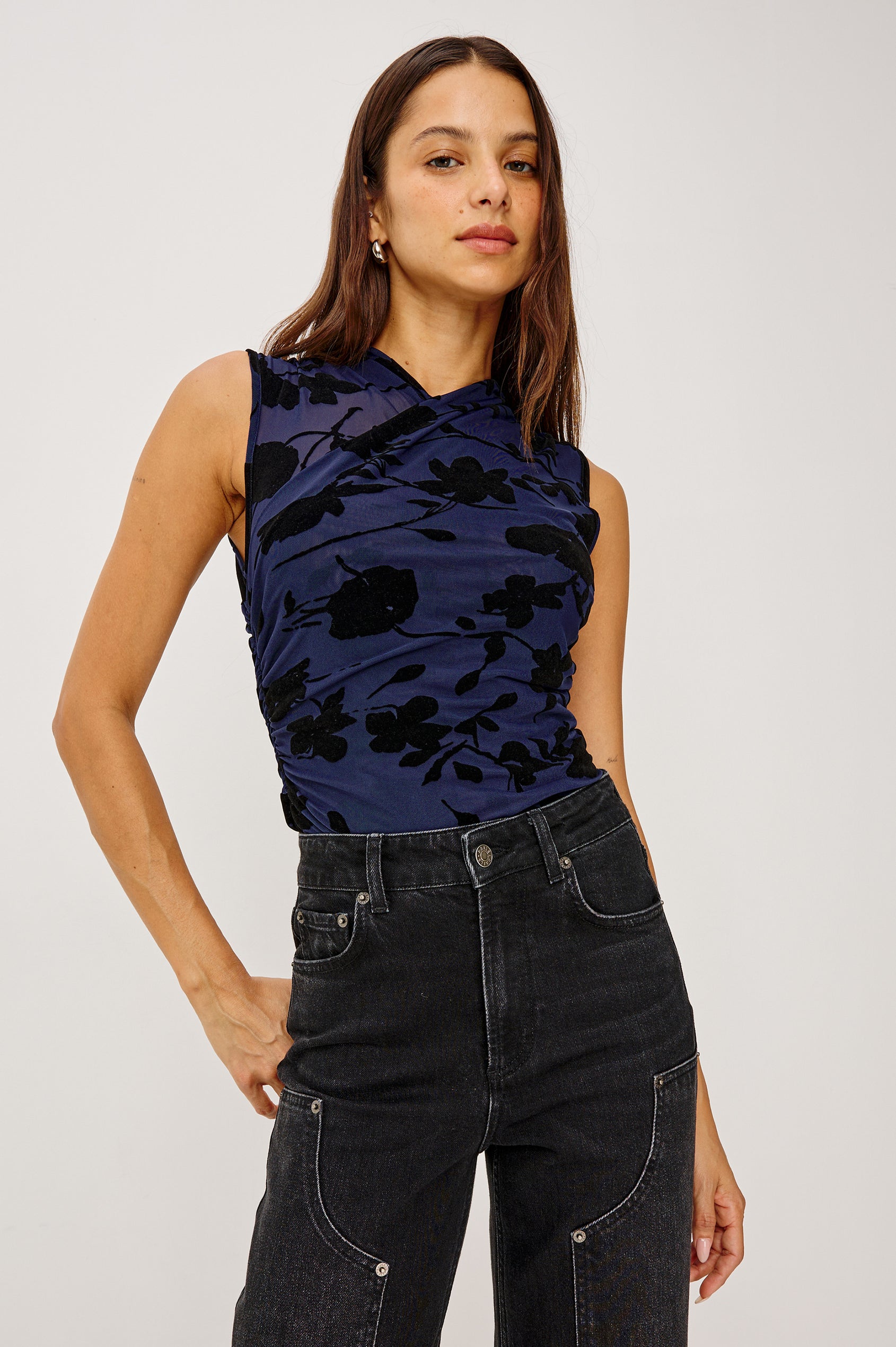 Lauris Sleeveless Top in Stretch Mesh With Velvet-Flocked Floral Motifs, Wrap-Style Bodice, Side Ruching, and Fully Lined in Navy Tossed Roses Colorway - Upper Body Front View Featured on Model