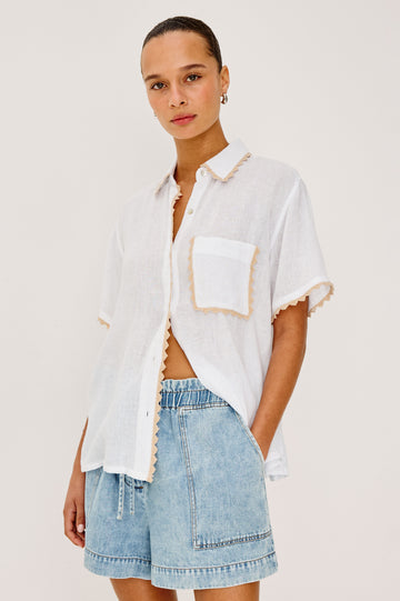 Lea Top in Luxe Linen With Relaxed Fit, Split V-Neck, Crochet Trim, and Flutter Sleeves With Natural Crochet Colorway - Upper Body Front View Featured on Model