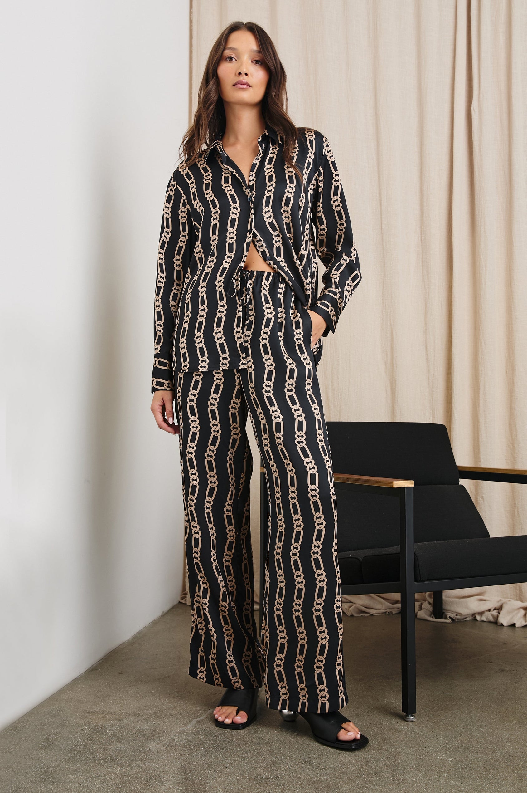 Ledger Long-Sleeve Button Down in Black Gold Link Colorway, vertical gold links on black - Front Full Body View Featured on Model