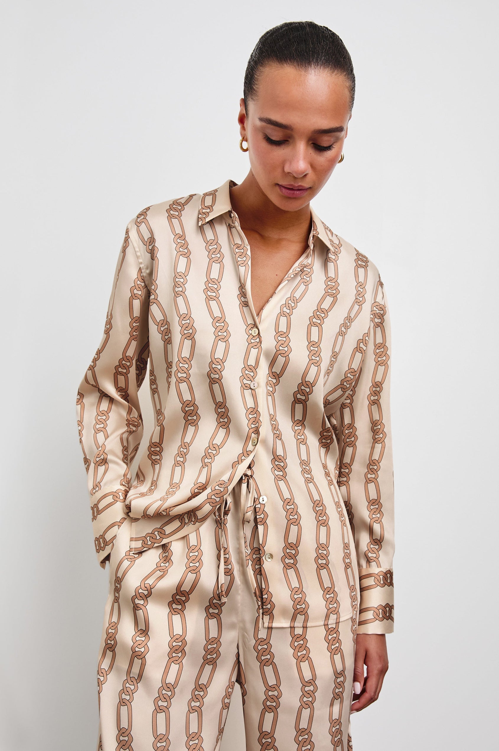 Ledger Long-Sleeve Button Down in Ivory Gold Link Colorway, vertical gold links on tan - Front View Featured on Model