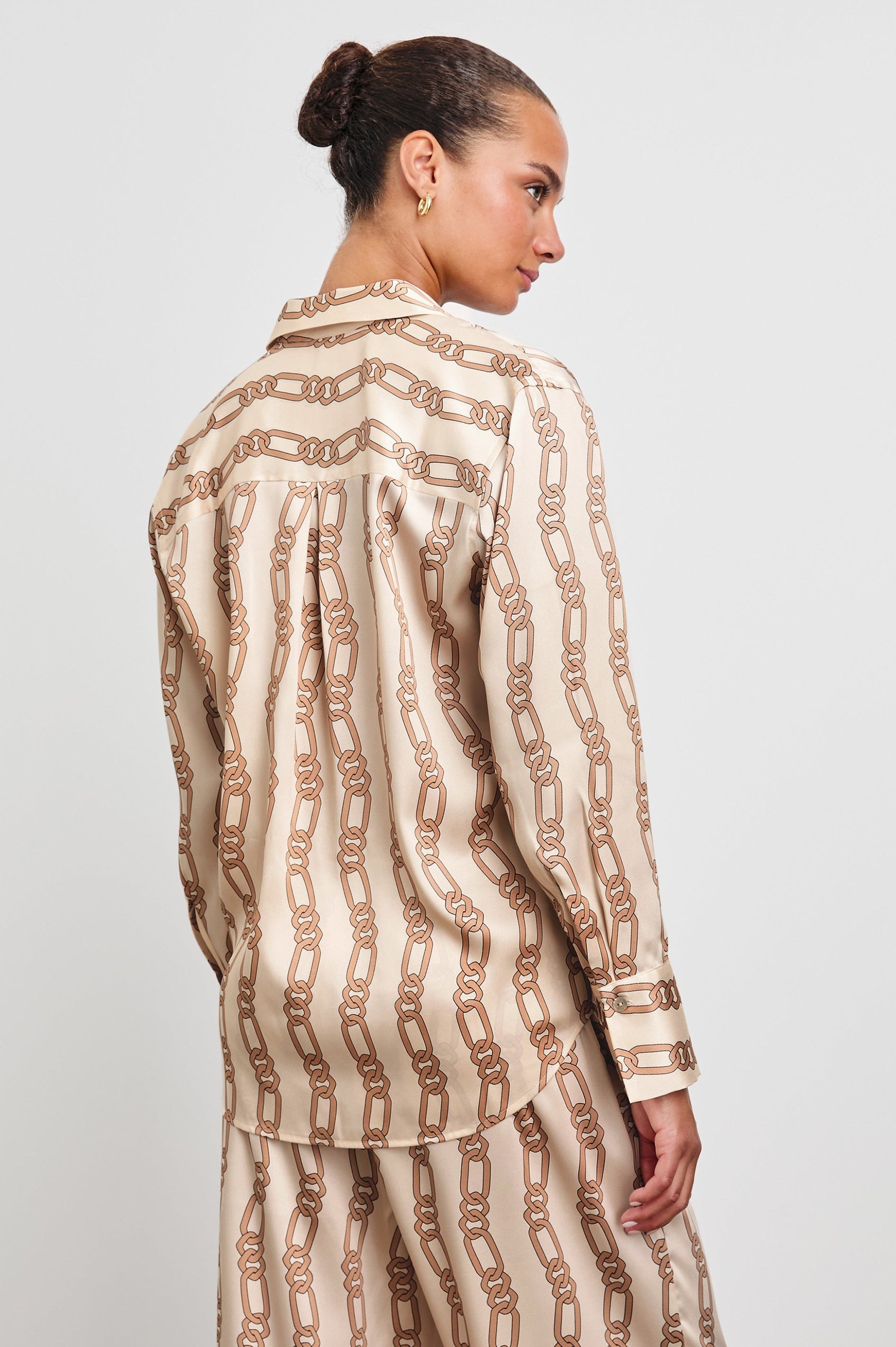 Ledger Long-Sleeve Button Down in Ivory Gold Link Colorway, vertical gold links on tan - Back View Featured on Model