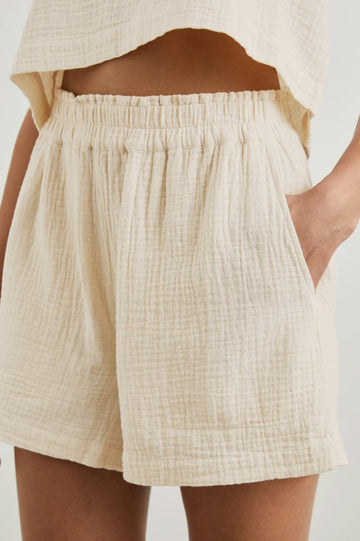 Leighton Shorts with Textured Fabric, a Smocked Elastic Waist, and Large Front Pockets in Flax Colorway - Front View Featured on Model