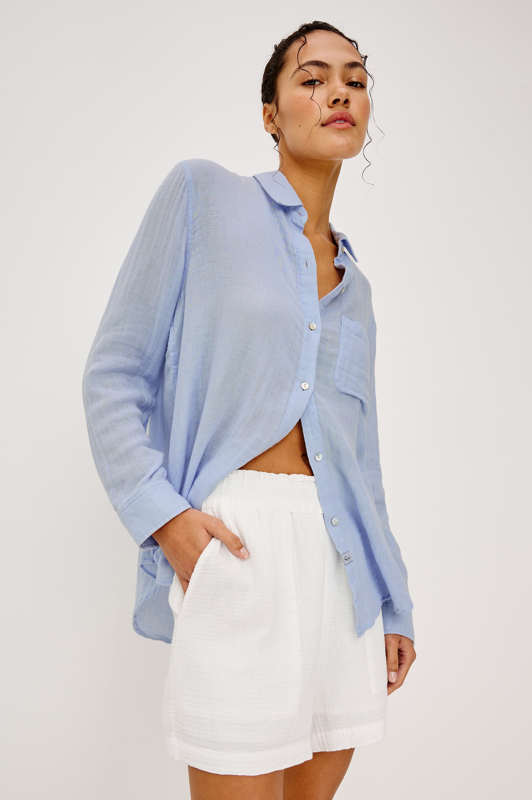 Leighton Shorts with Textured Fabric, a Smocked Elastic Waist, and Large Front Pockets in White Colorway - Upper Body Front View Featured on Model