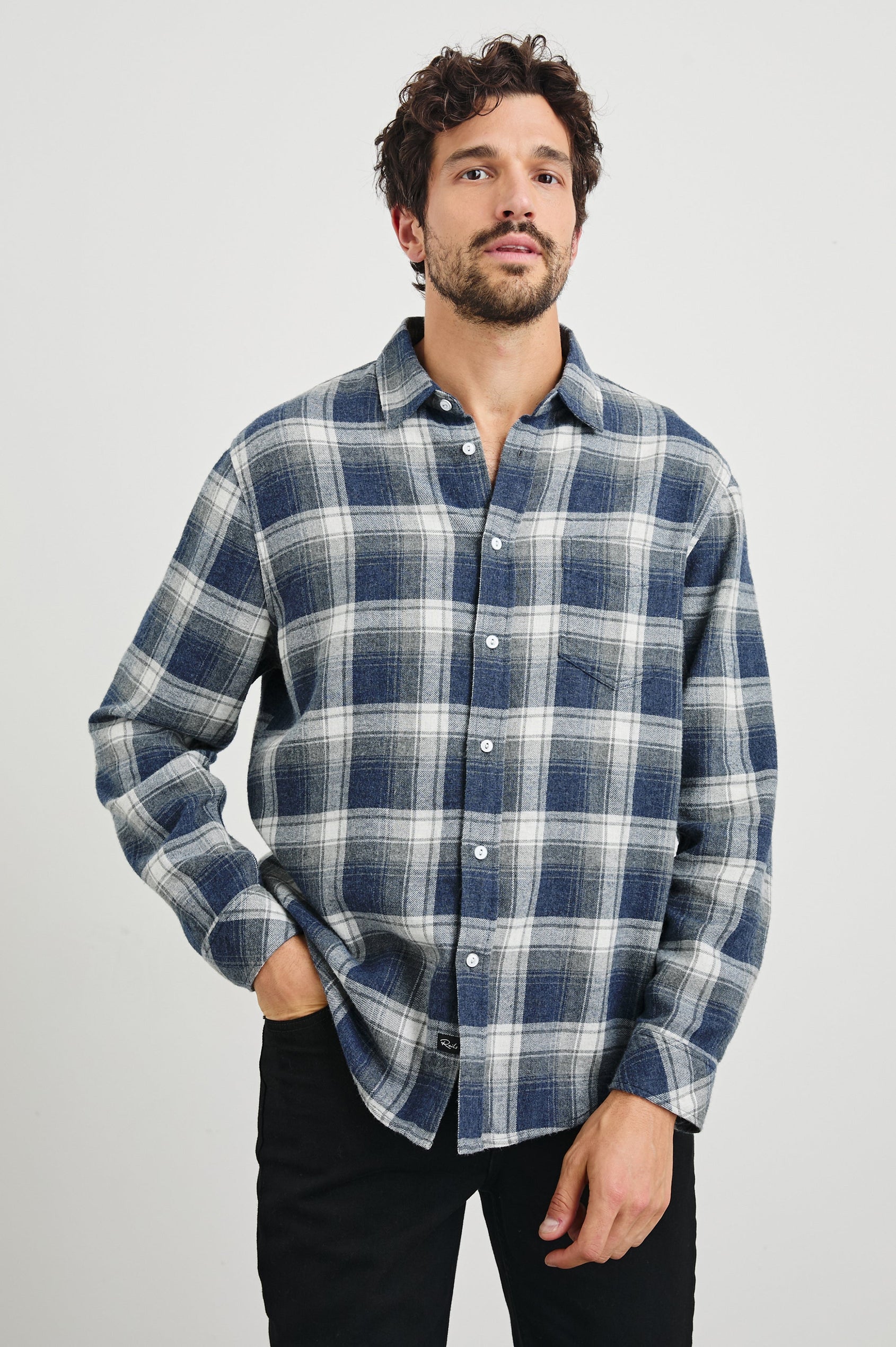 Lennox Long-Sleeve Button Up with a Chest Patch Pocket in Charcoal Lapis Colorway, a plaid in Charcoal, Lapis and White - Front View Featured on model
