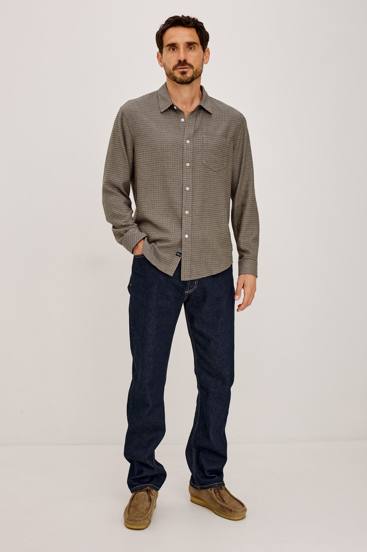Lennox Shirt in Houndstooth Cotton-Rayon Blend With Front Buttons, Single Chest Pocket, Point Collar, and Long Sleeves in Cotswold Houndstooth Colorway - Full Body Front View Featured on Model.