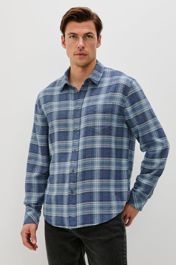 Lennox Long-Sleeve Button Up with a Chest Patch Pocket in Inkwell Melange Colorway, a plaid wtih dark and light blues - Front View Featured on model