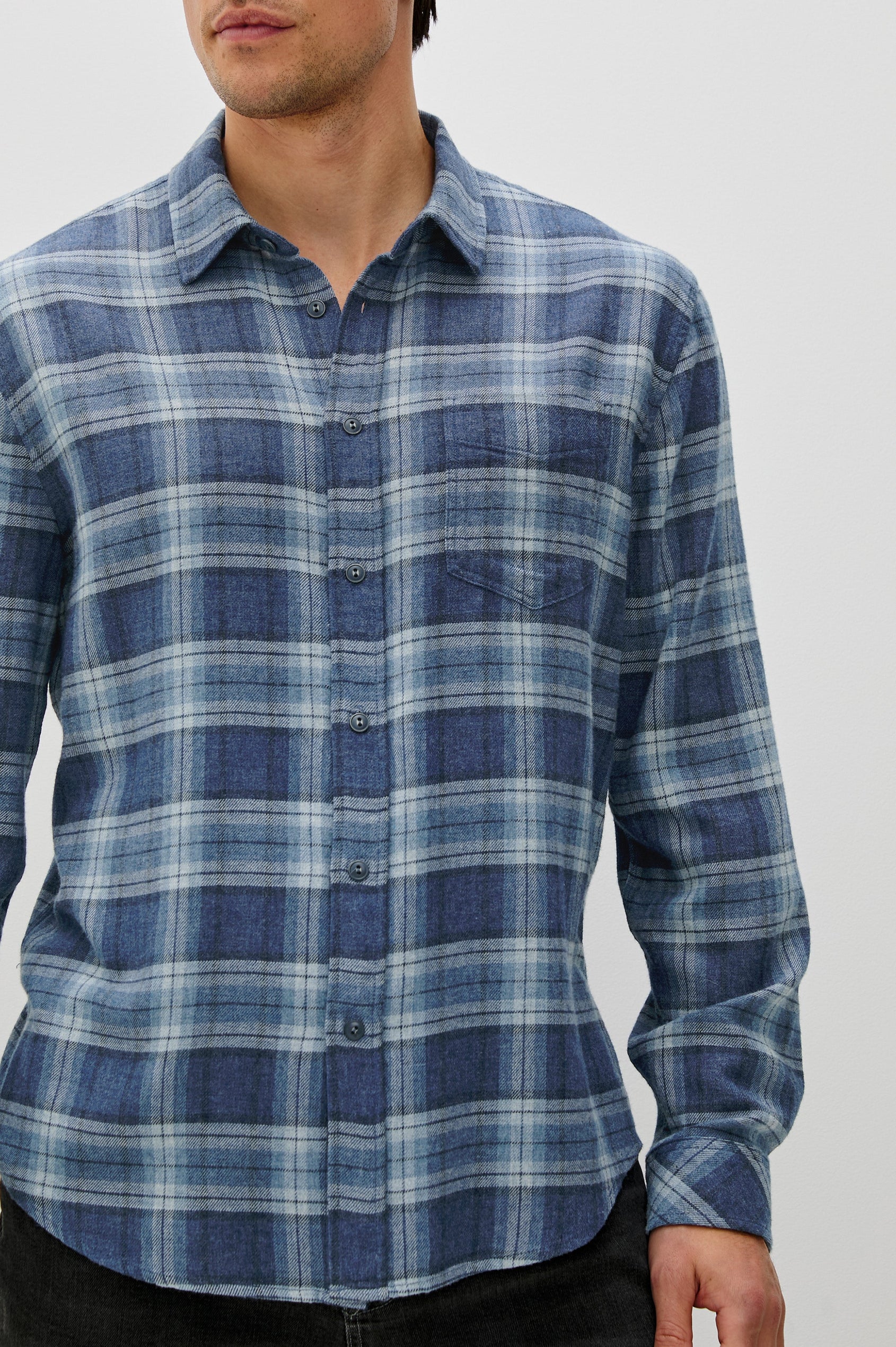 Lennox Long-Sleeve Button Up with a Chest Patch Pocket in Inkwell Melange Colorway, a plaid wtih dark and light blues - Front Detail View Featured on model