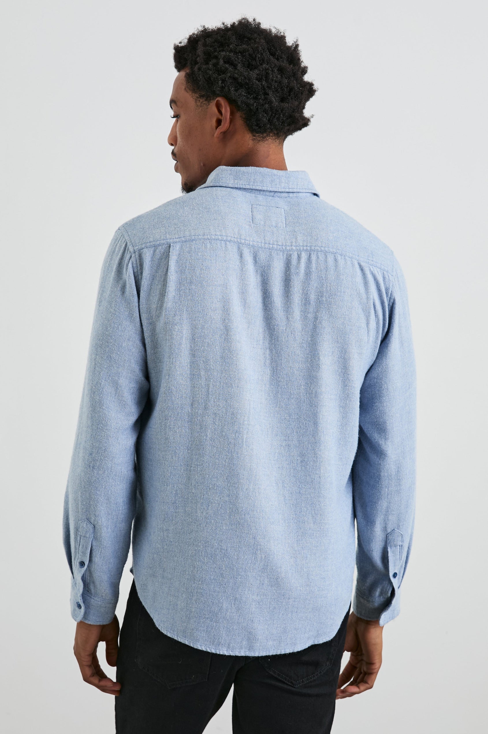 Lennox Long-Sleeve Button Up with a Chest Patch Pocket in Kodiak Blue Melange Colorway - Back View Featured on Model