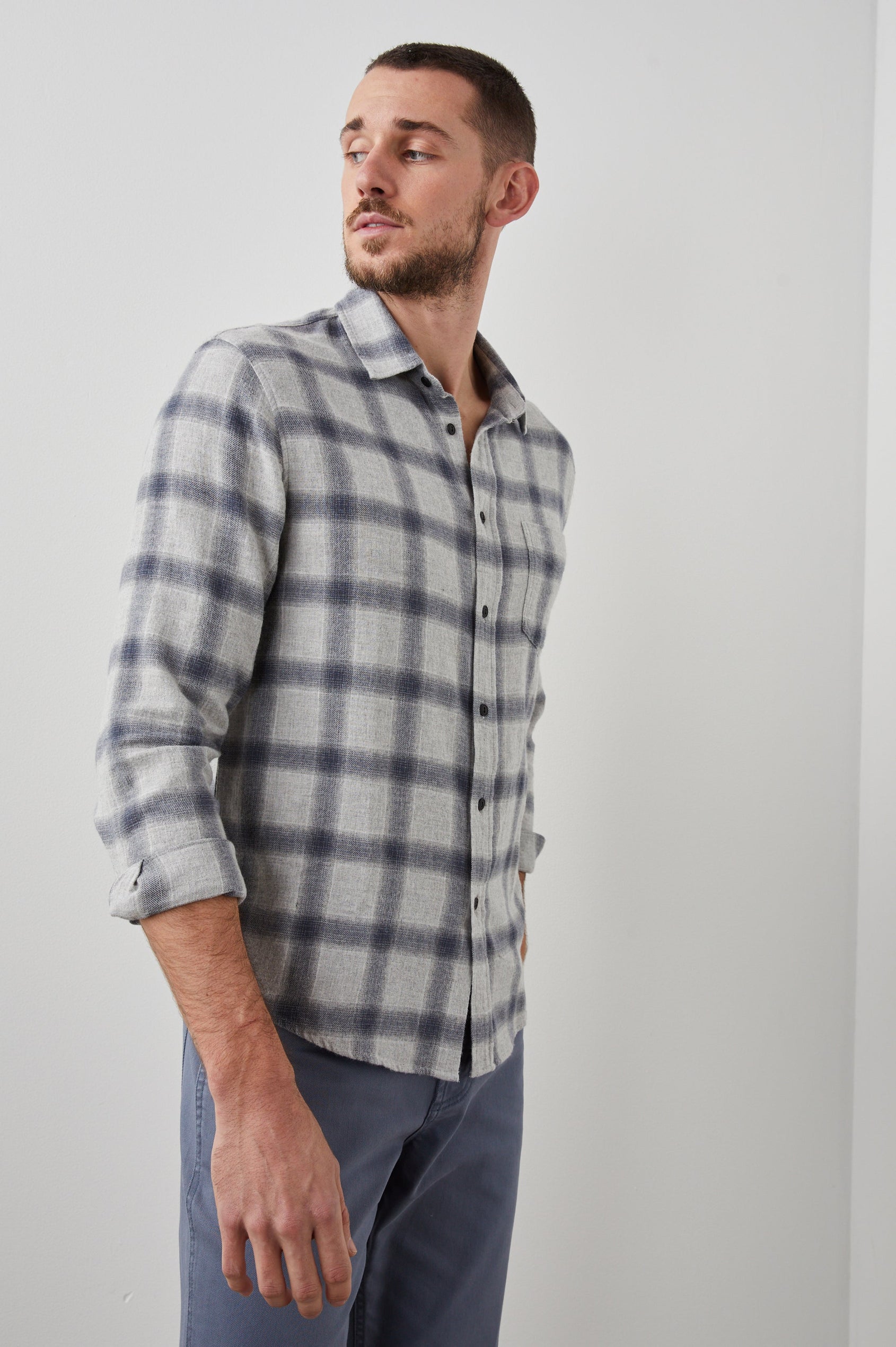 Lennox Long-Sleeve Button Up with a Chest Patch Pocket in Metallic Storm Heather Colorway, a plaid in Grey and Blue - Front View Featured on Model