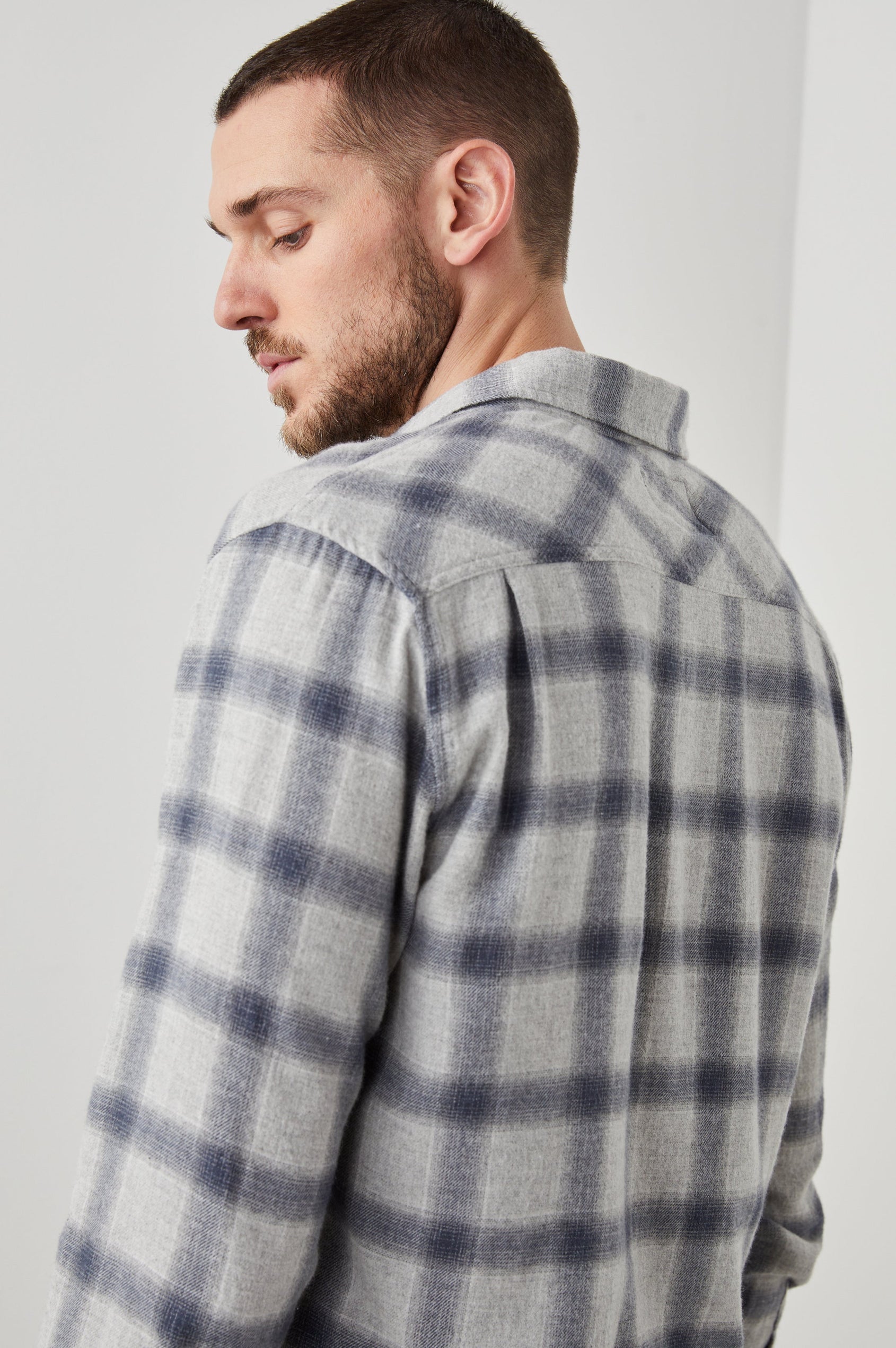 Lennox Long-Sleeve Button Up with a Chest Patch Pocket in Metallic Storm Heather Colorway, a plaid in Grey and Blue - Back View Featured on Model