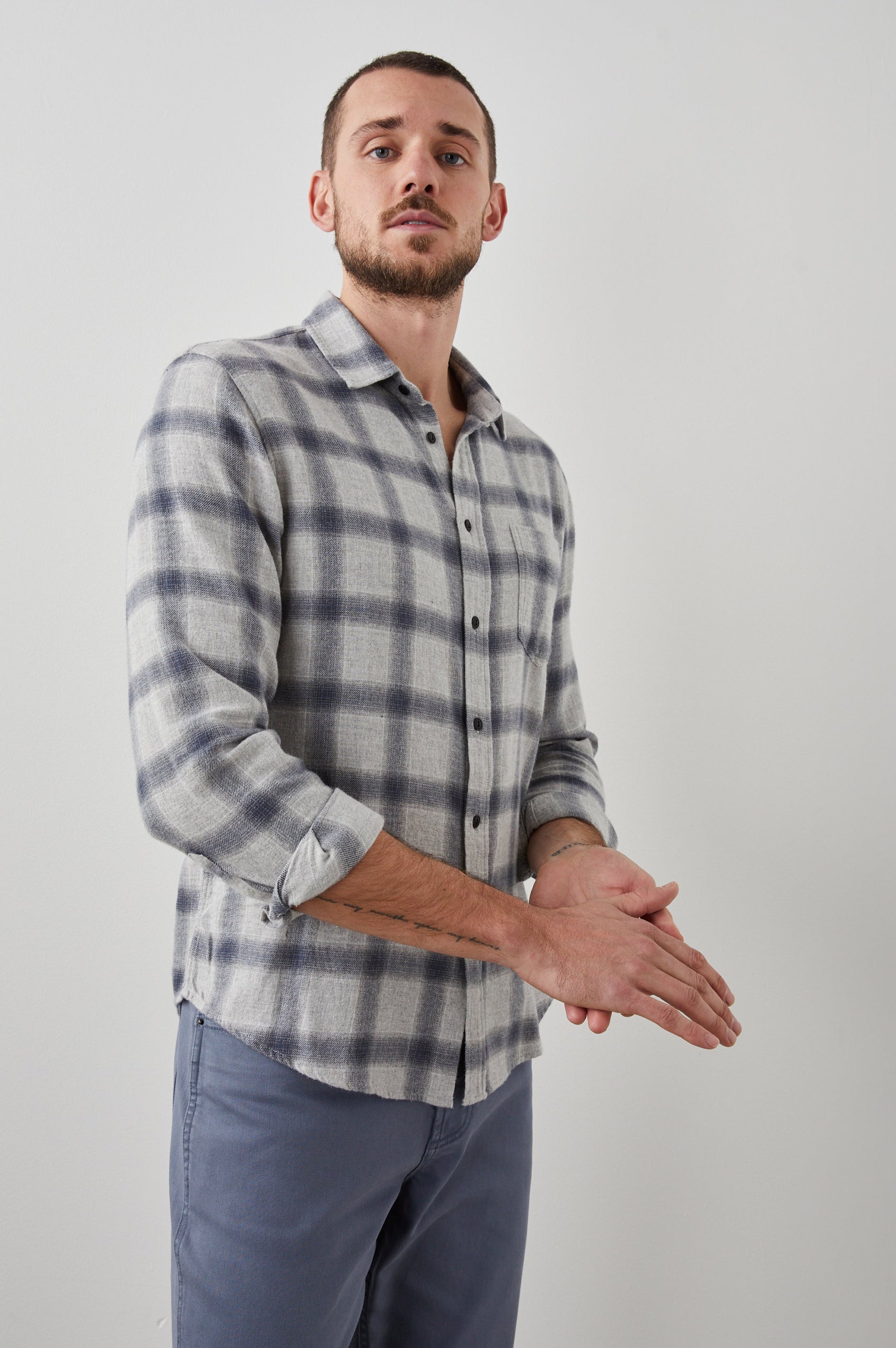 Lennox Long-Sleeve Button Up with a Chest Patch Pocket in Metallic Storm Heather Colorway, a plaid in Grey and Blue - Front View Featured on Model