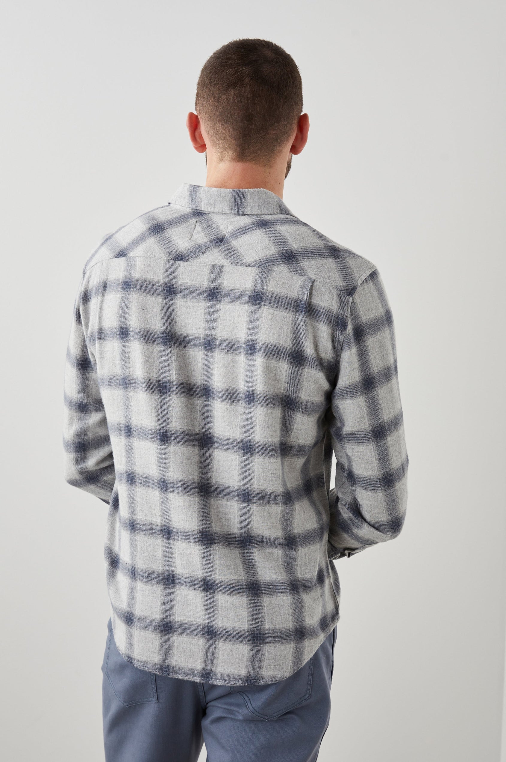 Lennox Long-Sleeve Button Up with a Chest Patch Pocket in Metallic Storm Heather Colorway, a plaid in Grey and Blue - Back View Featured on Model