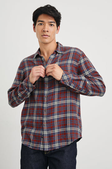 Lennox Long-Sleeve Button Up with a Chest Patch Pocket in Navy Red Cream Colorway, a plaid - Front View Featured on Model