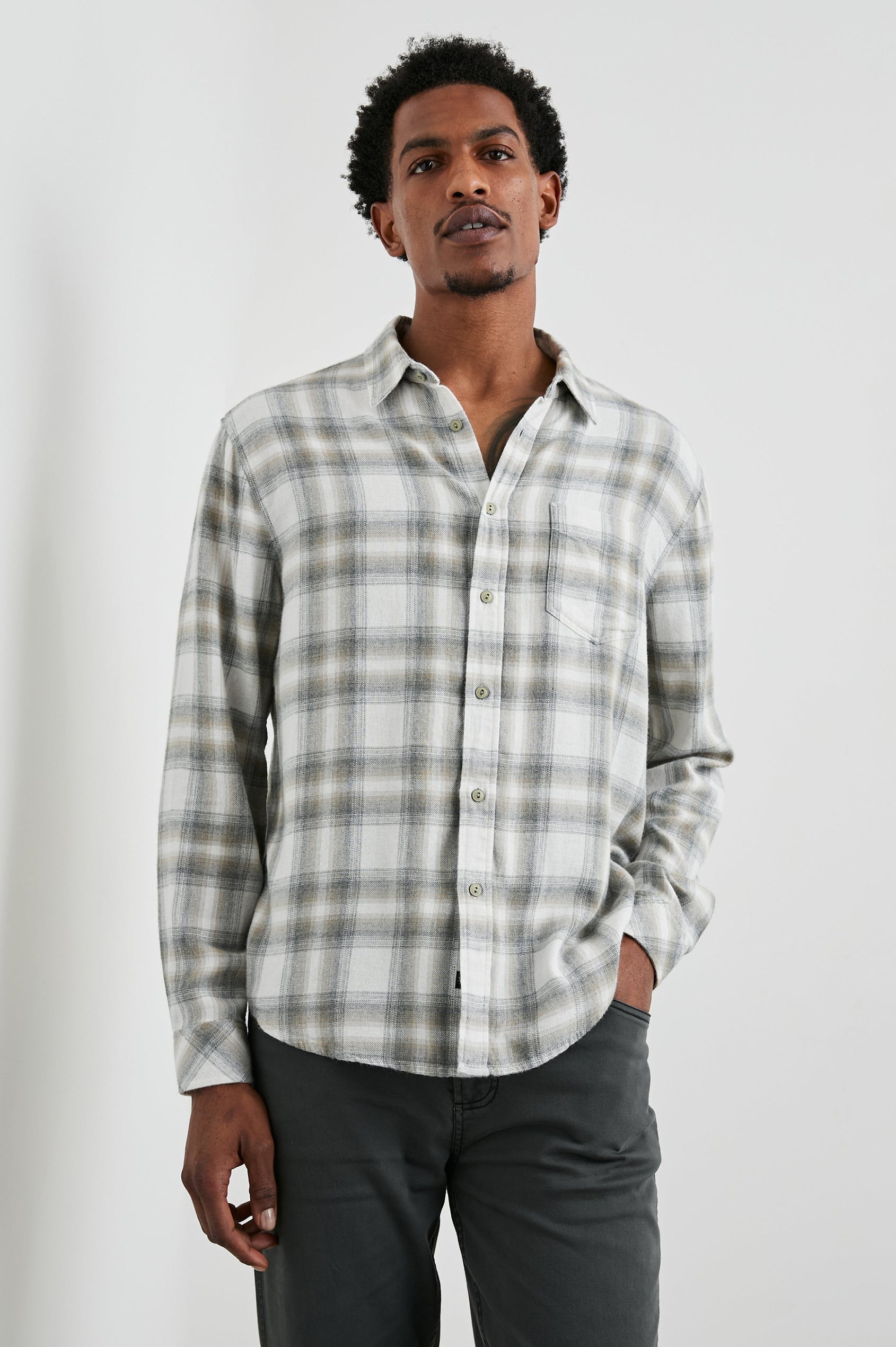 Lennox Long-Sleeve Button Up with a Chest Patch Pocket in Quicksand Spark Melange Colorway, a plaid in Grey, White and Tan - Front View Featured on Model