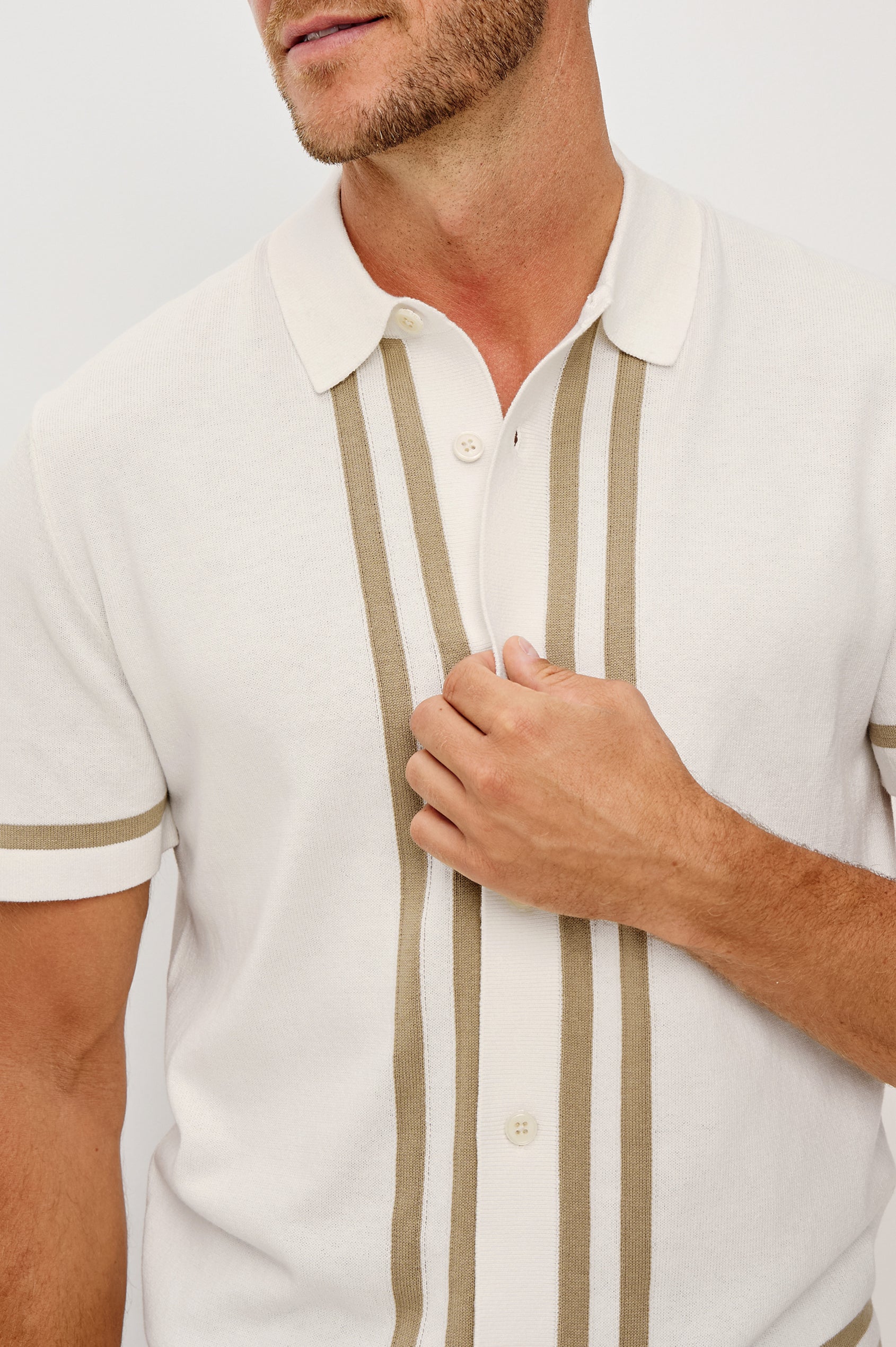 Leo Knit Sweater Polo in Yarn-Dyed Cotton Blend With Collar, Front Buttons, and Short Sleeves in White Cashew Colorway - Upper Body Close Up Front View Featured on Model