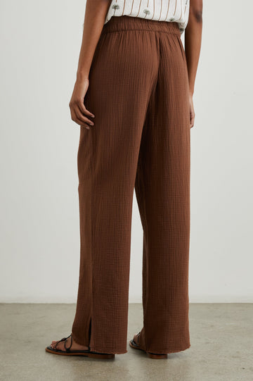 Leon Pant with a Smocked Waistband, Short Side Slits on Outer Leg and Two Front Seam Pockets in Cacao Colorway - Back View Featured on Model