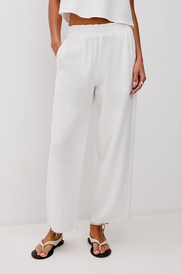 Leon Crop Cotton Gauze Pant With Hemline Slit And Elastic Waist In Colorway White - Front View Featured On Model