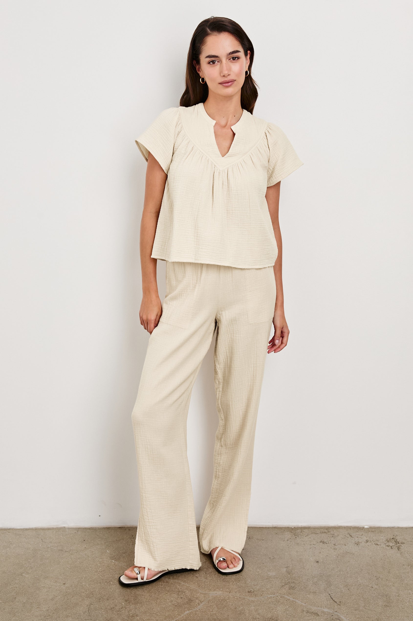Leon Cotton Gauze Pant With Hemline Slit And Elastic Waist In Colorway Flax -  Full Front Body View Featured On Model