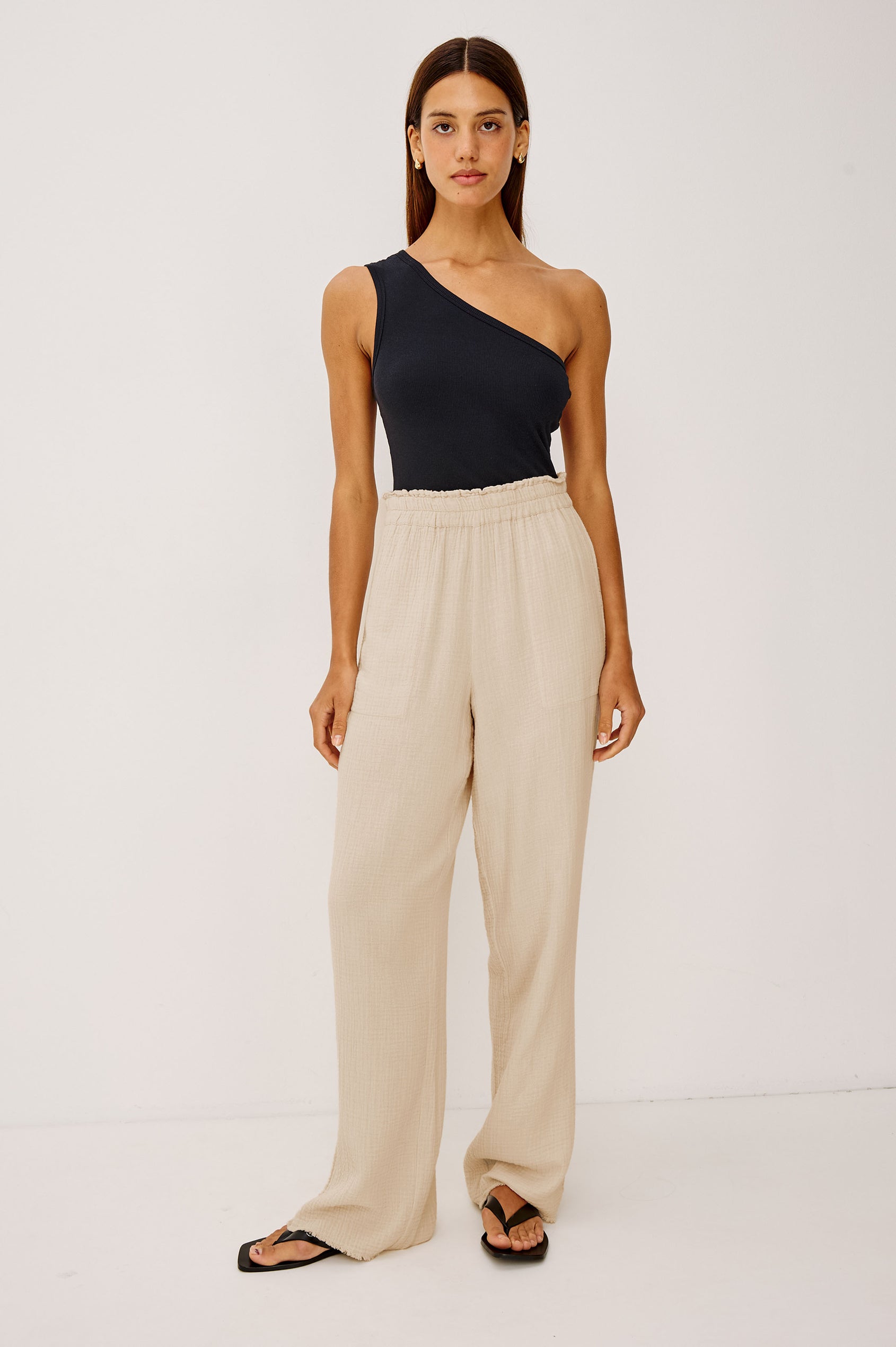 Leon Cotton Gauze Pant With Hemline Slit And Elastic Waist In Colorway Flax - Full Front Body View Featured On Model