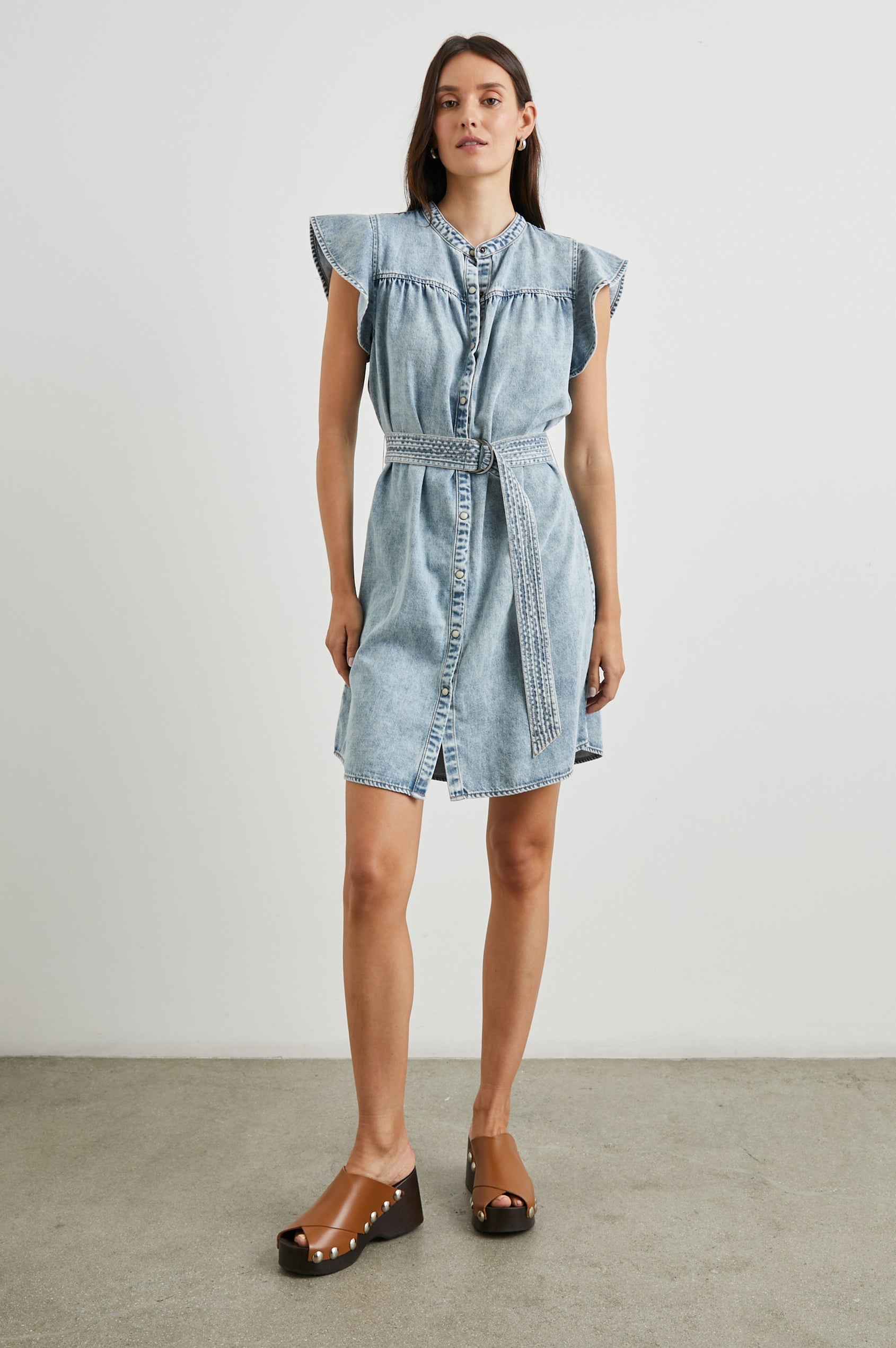 Letta Above-Knee Dress with Flutter Sleeves, Snaps down the Front, and a Belted Waist in Faded Indigo Colorway - Front Full Body View Featured on Model 