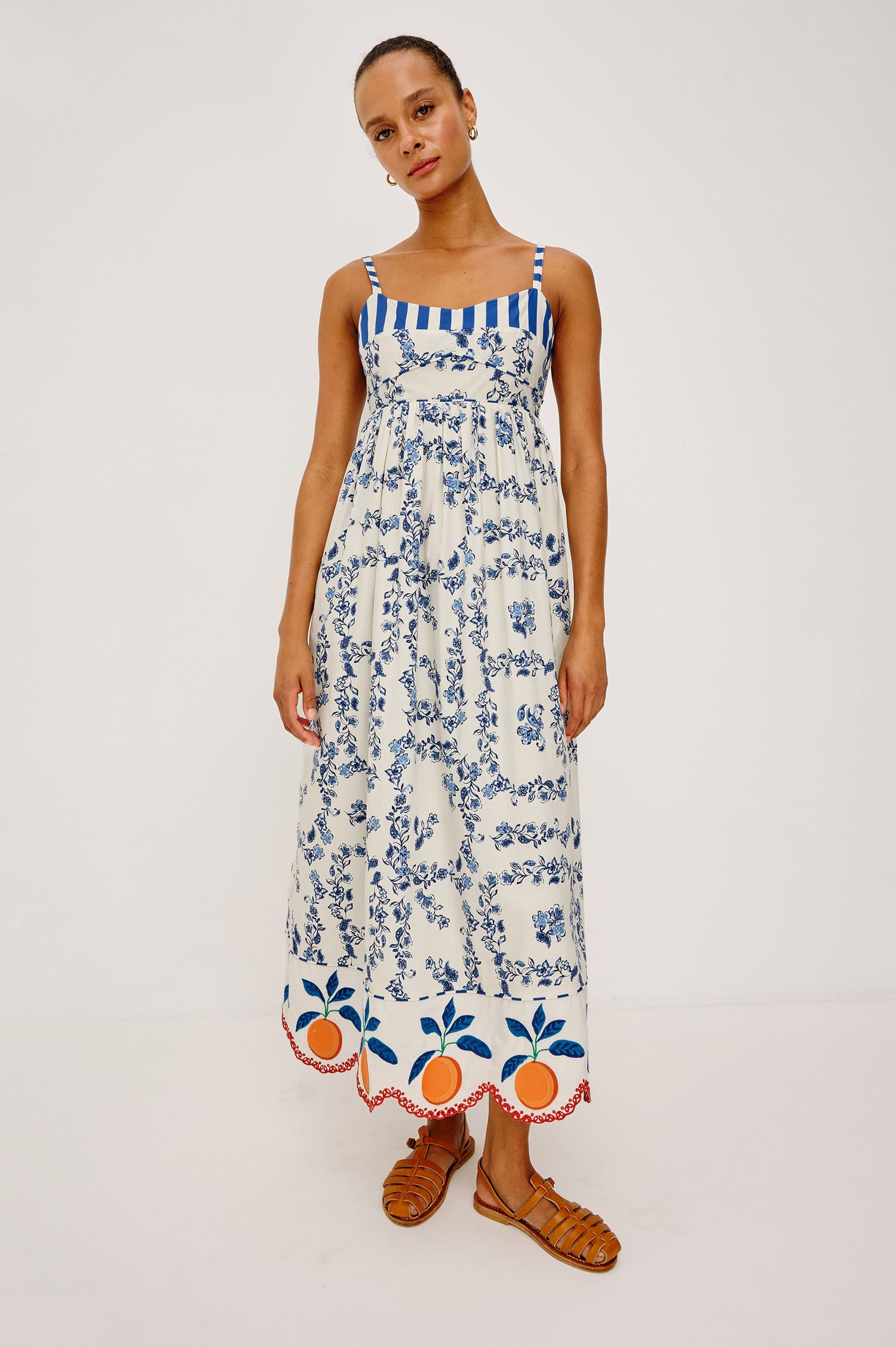 Lexie Maxi Dress in Cotton Poplin With Adjustable Shoulder Straps, Empire Waist, Piped Detailing, Orange Embroidery and Eyelet Hem, and is Fully Lined -