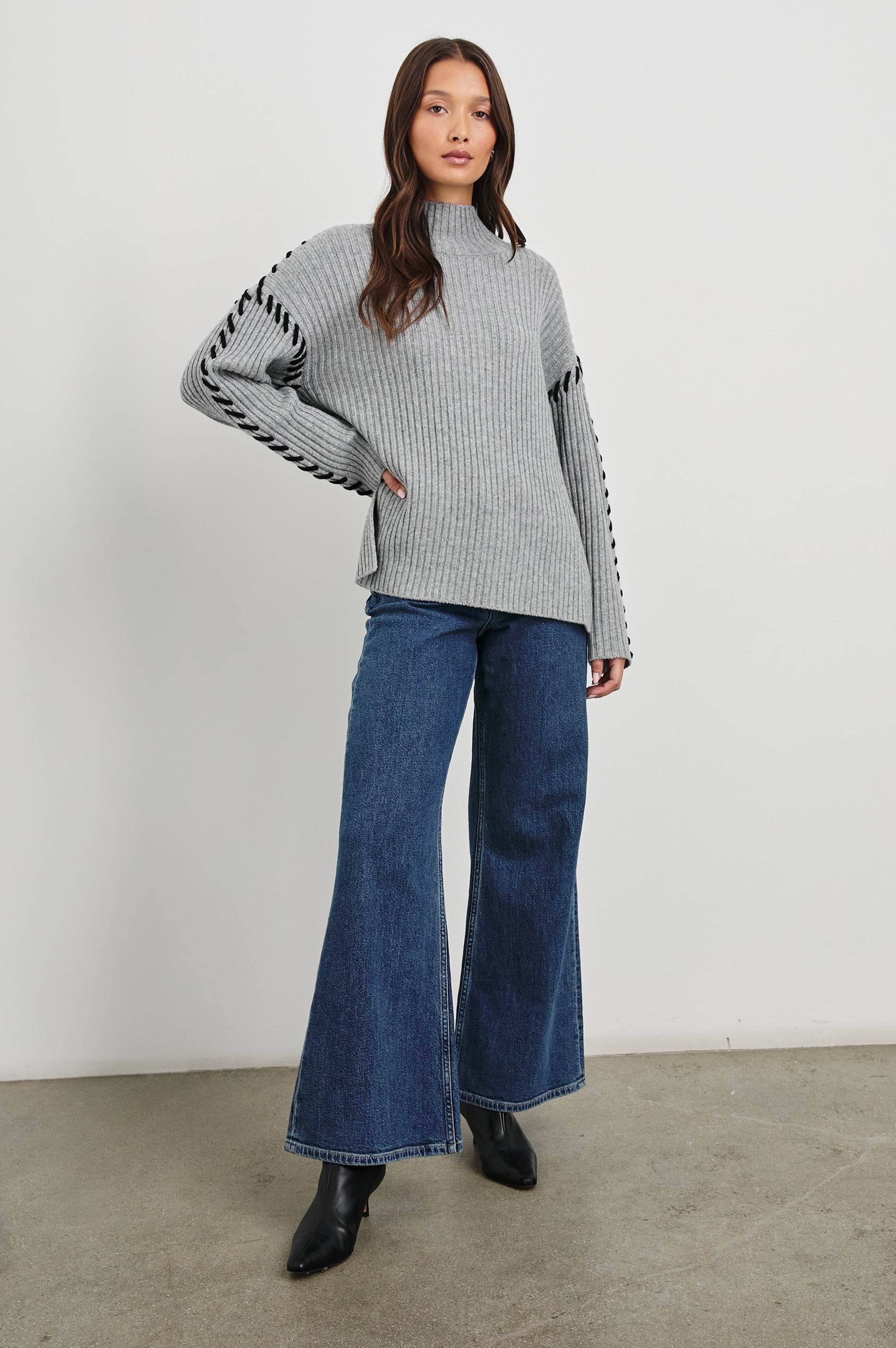 Liam Long-Sleeve Sweater with Turtle Neckline in Heather Grey Colorway, with Black Rib Stitching on Arms - Front Full Body View Featured on Model