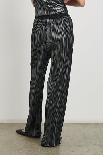 Liana Micro-Pleated Pants with an Elastic Waist in Gunmetal Colorway, Thin black, white and grey Vertical Stripes - Back View Featured on Model 