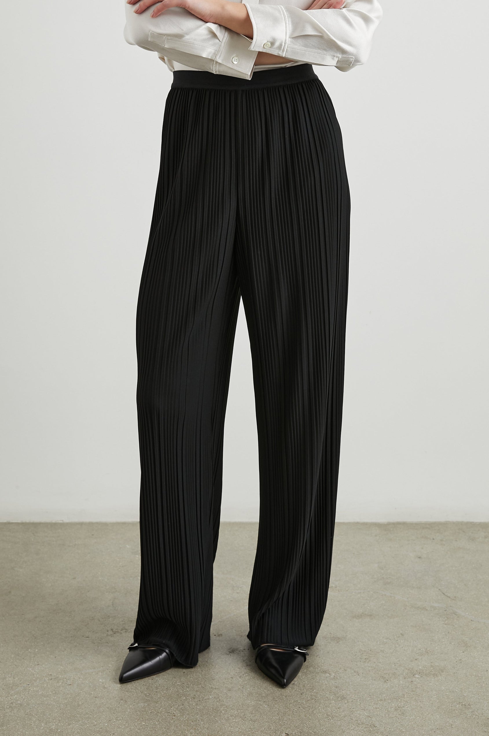 Liana Micro-Pleated Pants with an Elastic Waist in Jet Colorway - Front View Featured on Model 