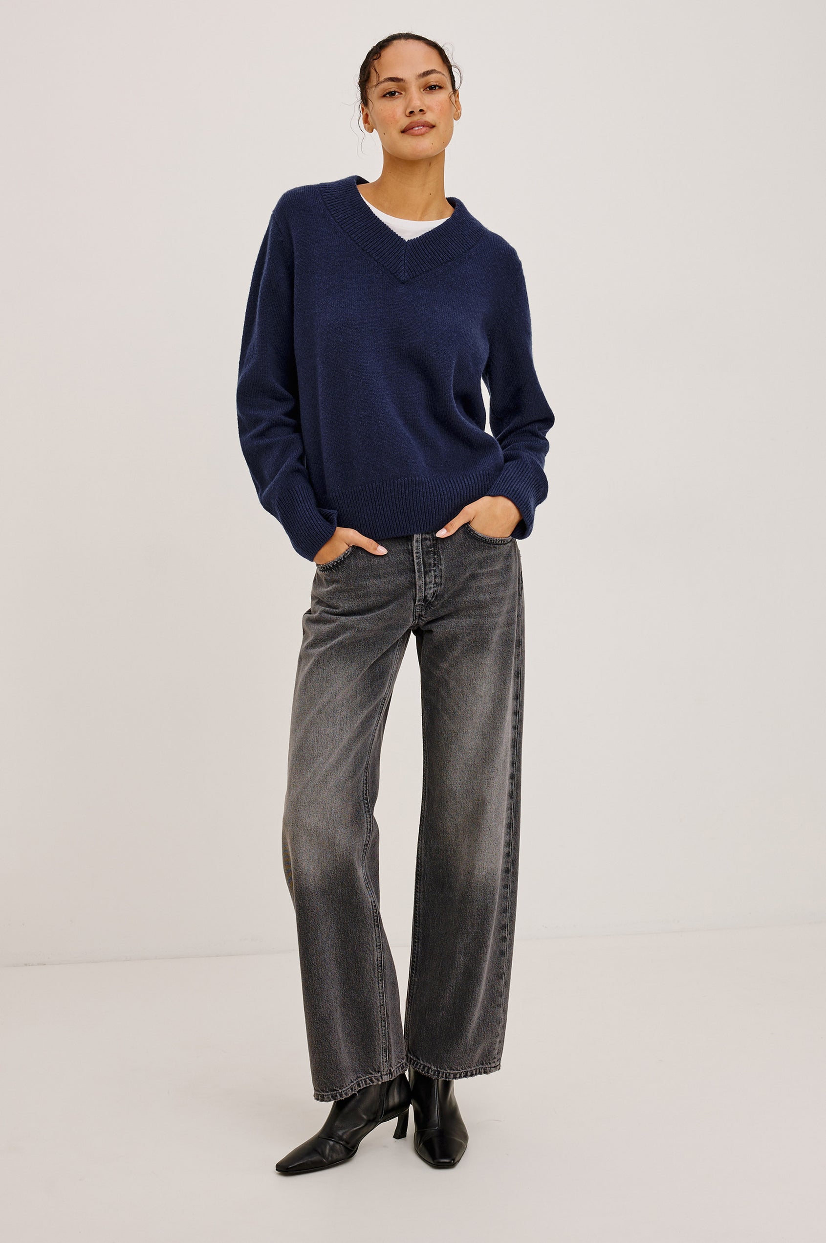 Lidya Sweater in Wool-Cashmere Knit Blend With V-Neckline, Loose Relaxed Fit, Long Sleeves, and Ribbed Trim in Navy Colorway - Full Body Front View Featured on Model