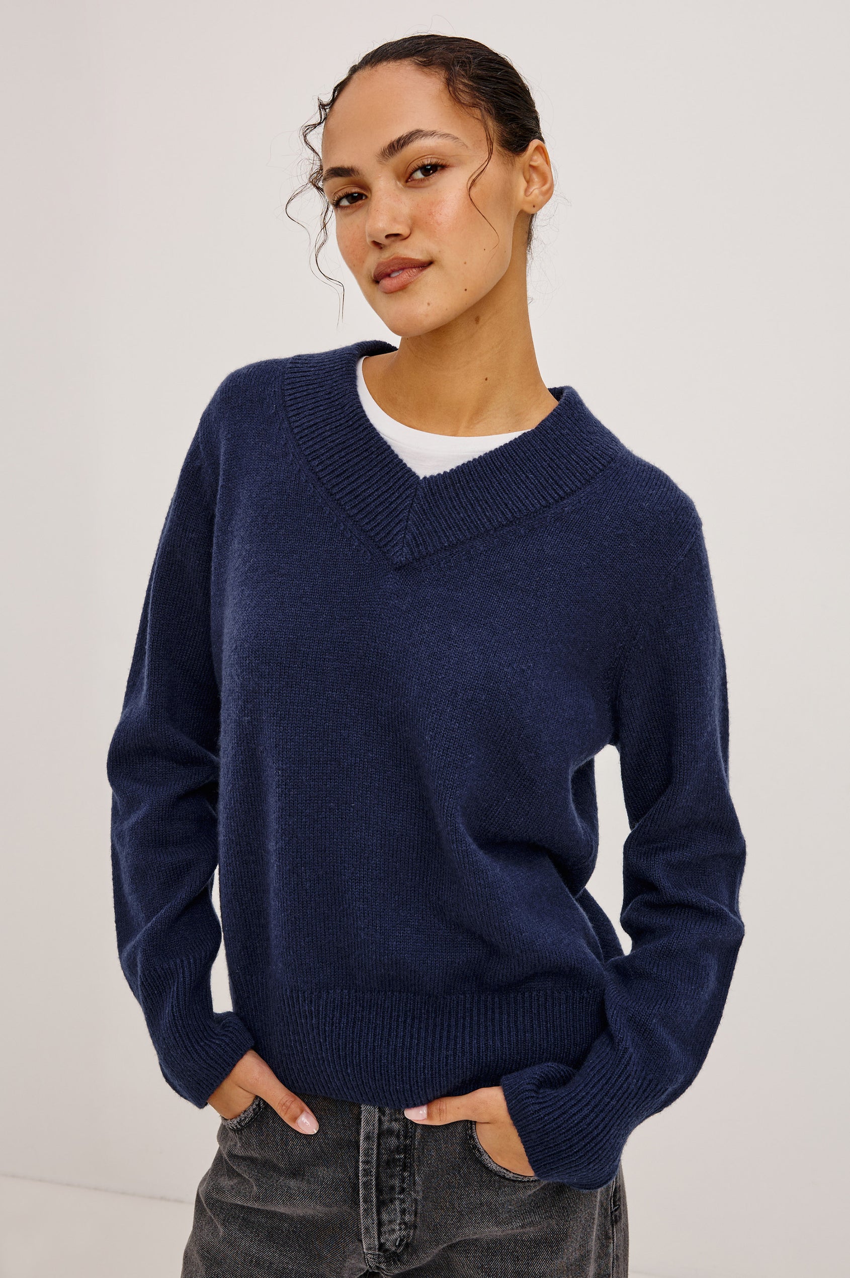 Lidya Sweater in Wool-Cashmere Knit Blend With V-Neckline, Loose Relaxed Fit, Long Sleeves, and Ribbed Trim in Navy Colorway - Full Body Front View Featured on Model