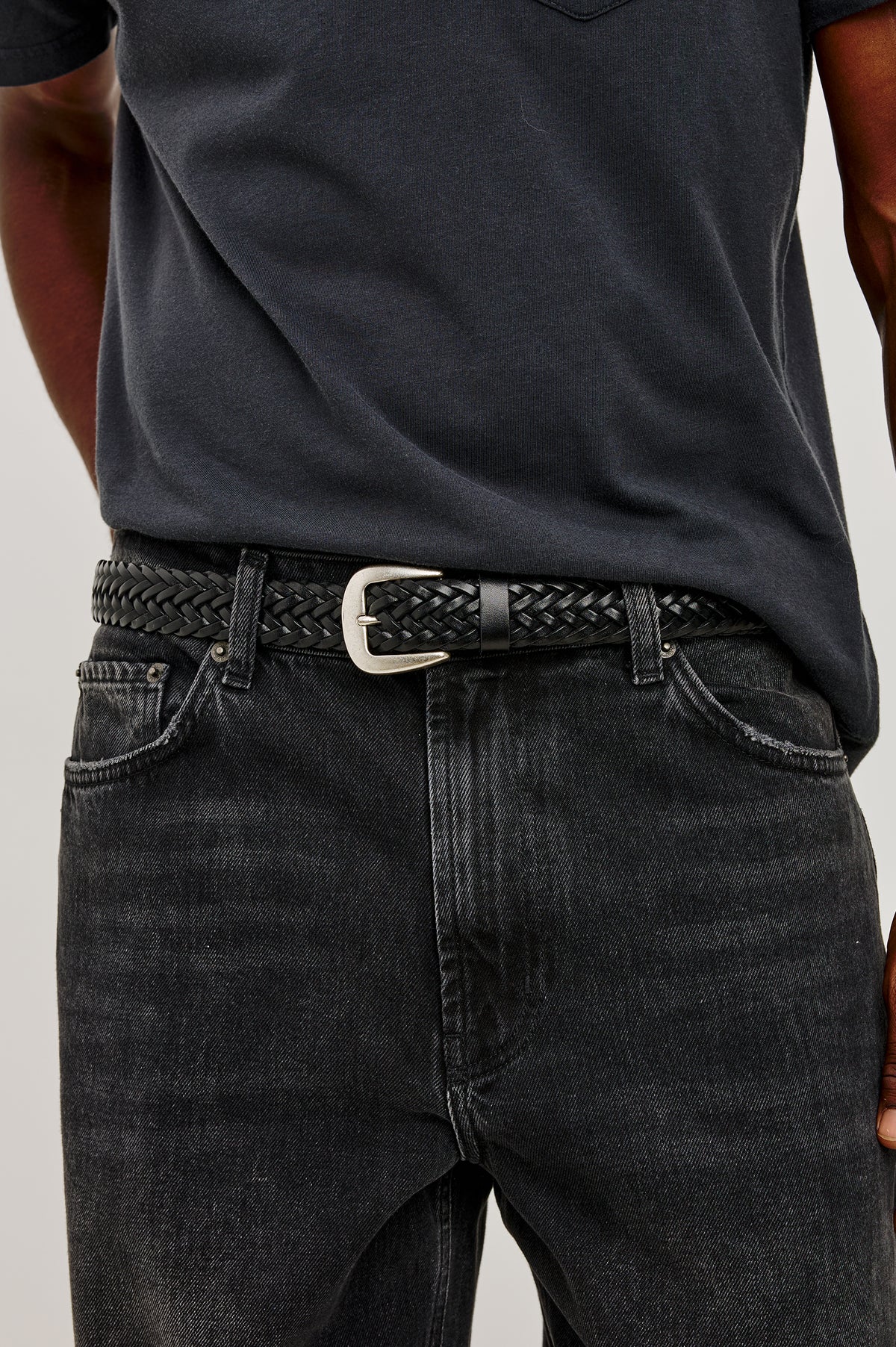 Liguria Belt in Leather With Braided Woven Strap and Adjustable Buckle in Woven Black Silver Colorway - Mid Body Front Close Up View Featured on Model
