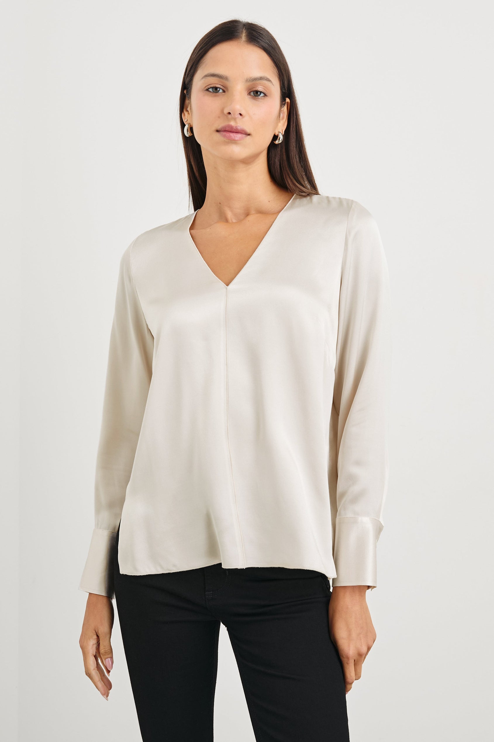 Liliana Long-Sleeve Top with a V Neck, Button Cuffs and a Vertical Seam Down the Front and Back in Ivory Colorway - Front View Featured on Model