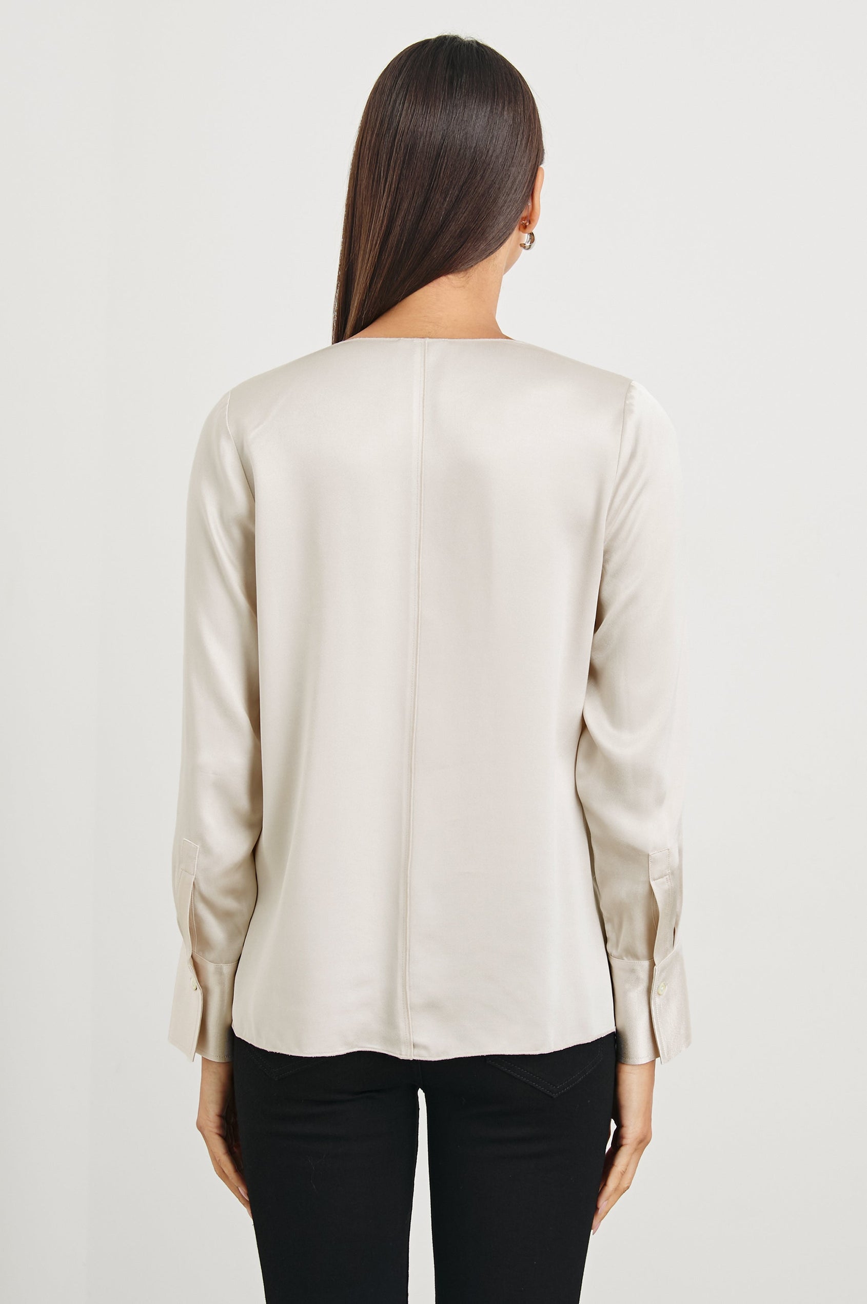 Liliana Long-Sleeve Top with a V Neck, Button Cuffs and a Vertical Seam Down the Front and Back in Ivory Colorway - Back View Featured on Model
