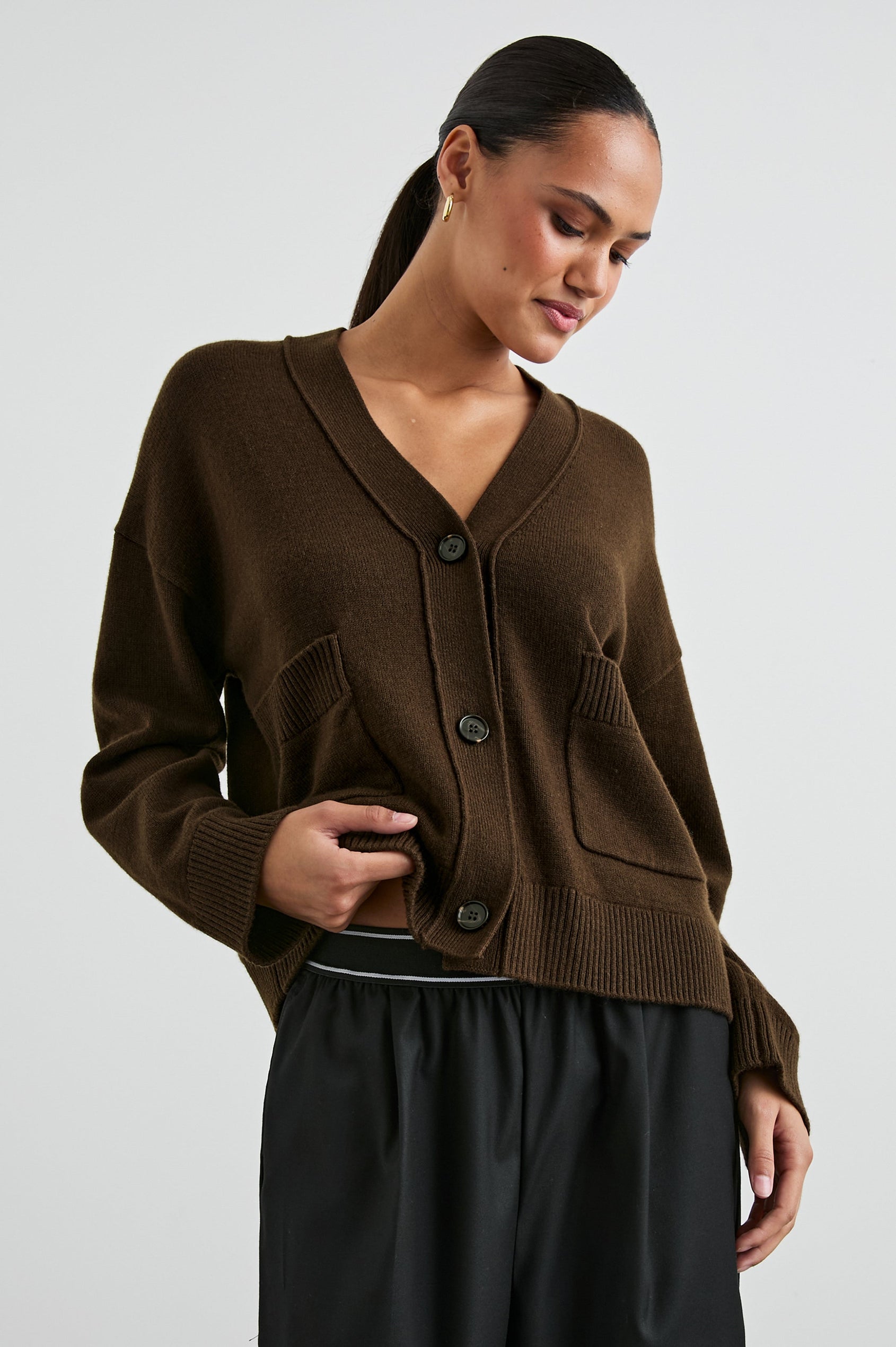 Lindi Long-Sleeve V Neck Cardigan with Three Button Closure, Two Front Patch Pockets and Ribbed Trim in Dark Moss Colorway - Front View Featured on Model