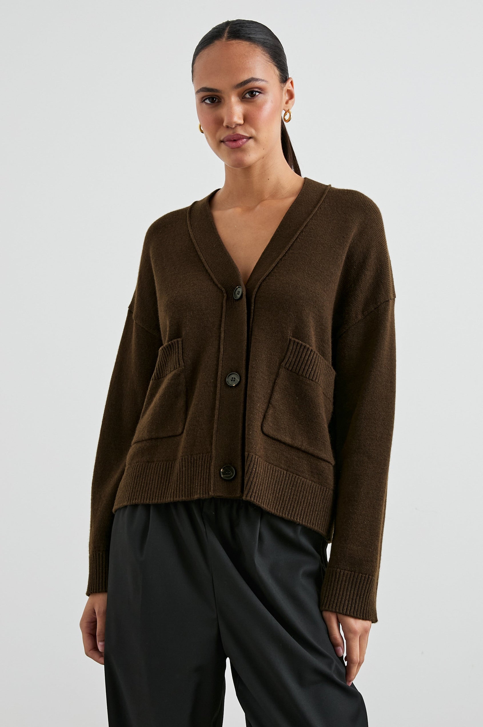 Lindi Long-Sleeve V Neck Cardigan with Three Button Closure, Two Front Patch Pockets and Ribbed Trim in Dark Moss Colorway - Front View Featured on Model