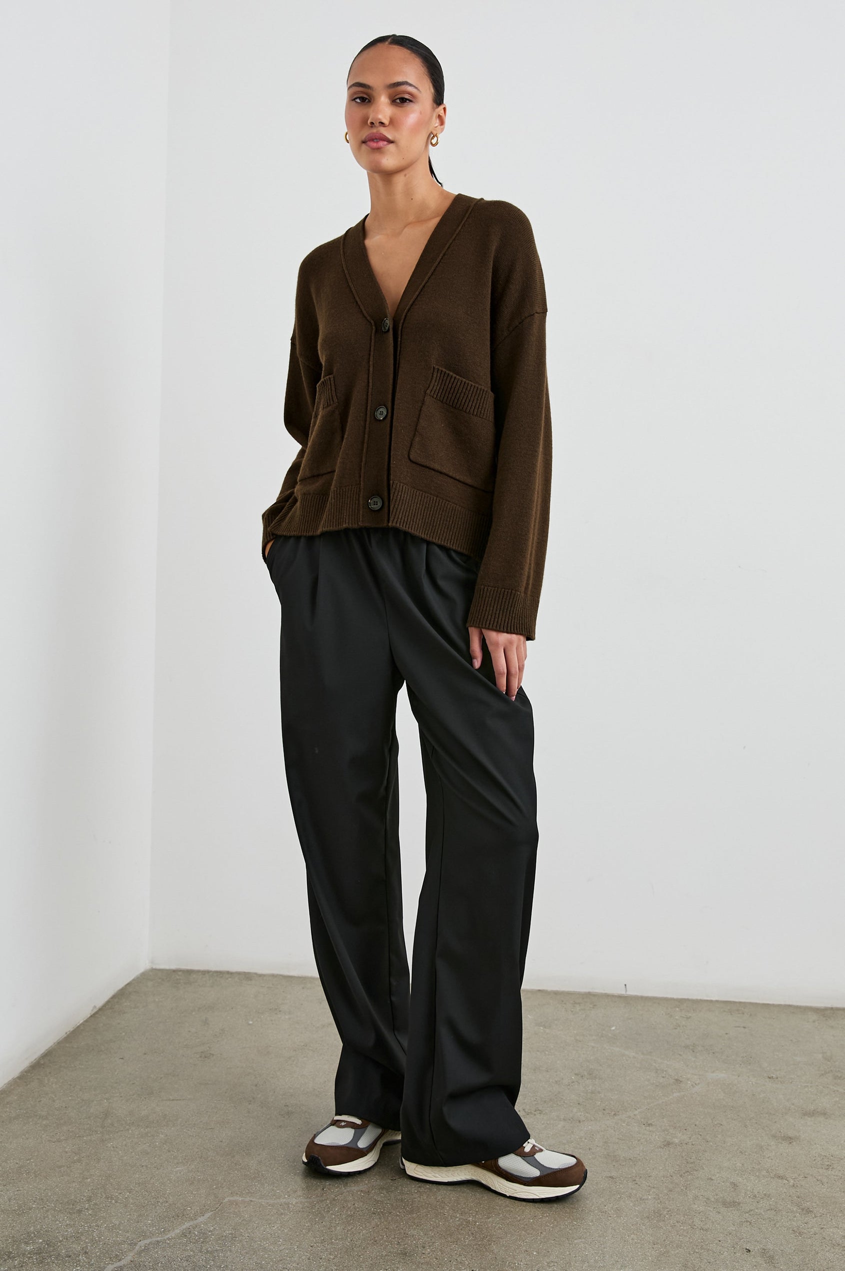 Lindi Long-Sleeve V Neck Cardigan with Three Button Closure, Two Front Patch Pockets and Ribbed Trim in Dark Moss Colorway - Front Full Body View Featured on Model