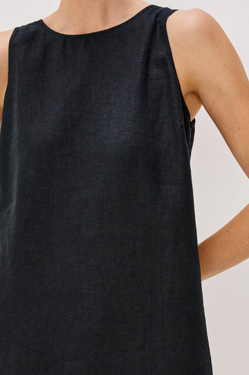 Lindsey Sleeveless Scoop Neck Mini Dress in Black Colorway. Front Detail View Shown on Model.