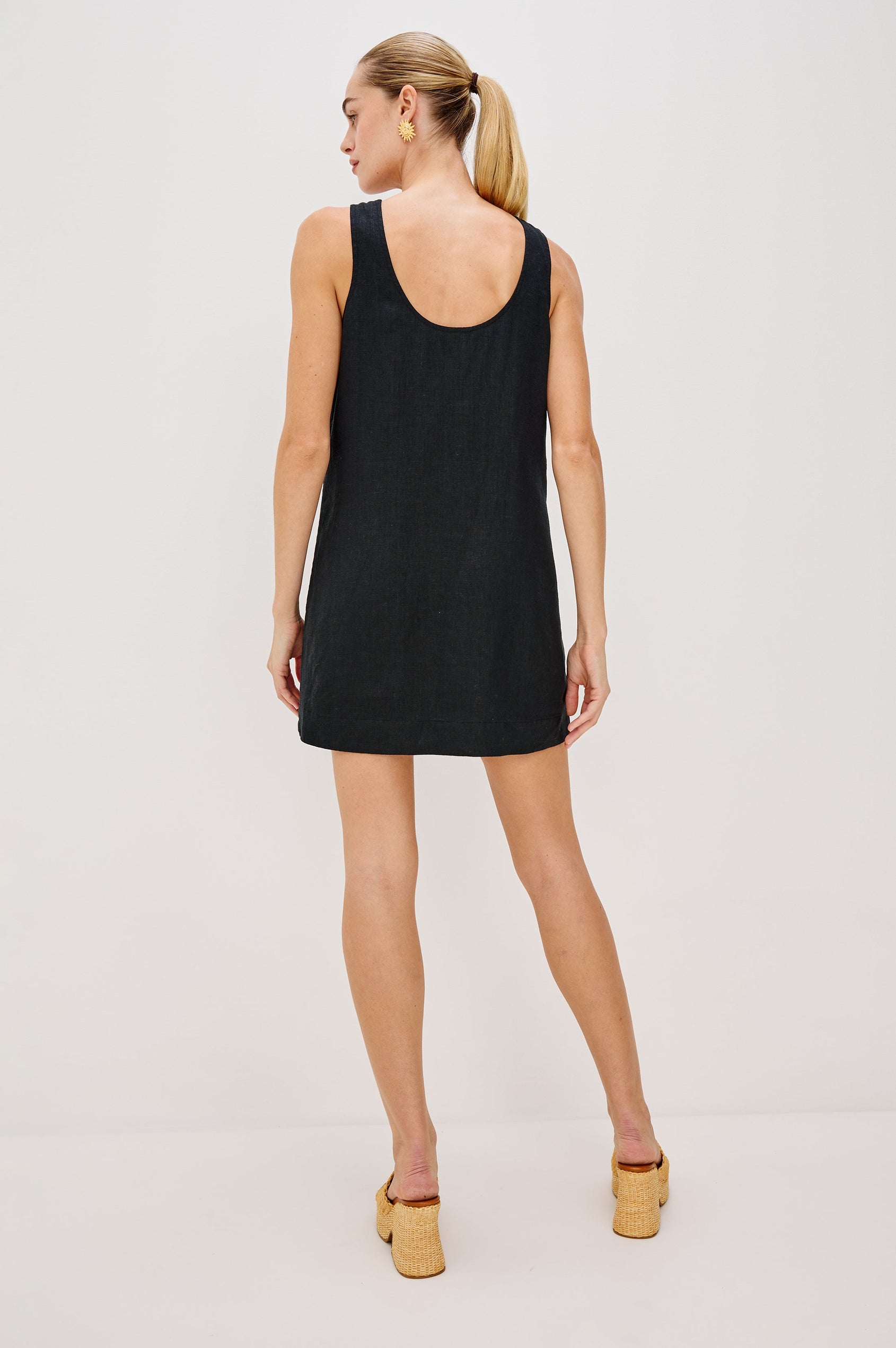 Lindsey Sleeveless Scoop Neck Mini Dress in Black Colorway. Full Body Back View Shown on Model.